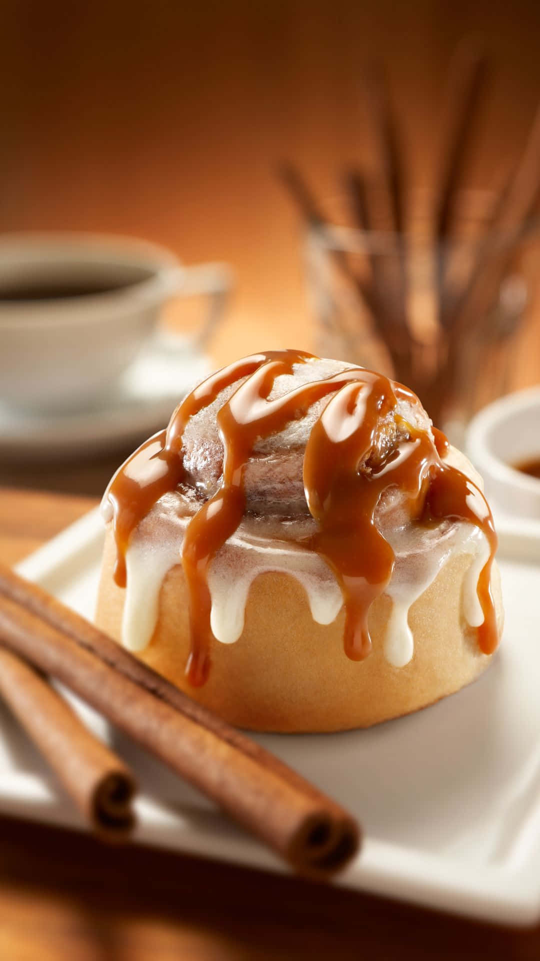 caramel glazed cinnamon roll, white plate, cinnamon sticks, Full HD Phone Wallpaper