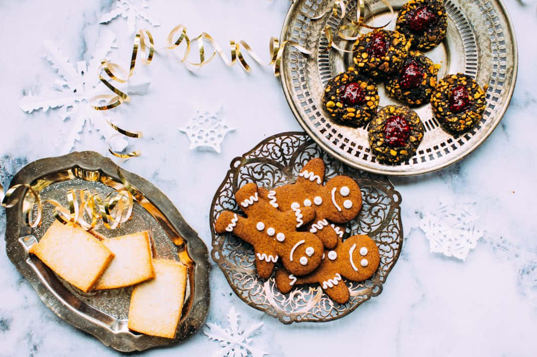 Gingerbread men, cherry-topped cookies, ornate silver plates, SD Desktop Wallpaper