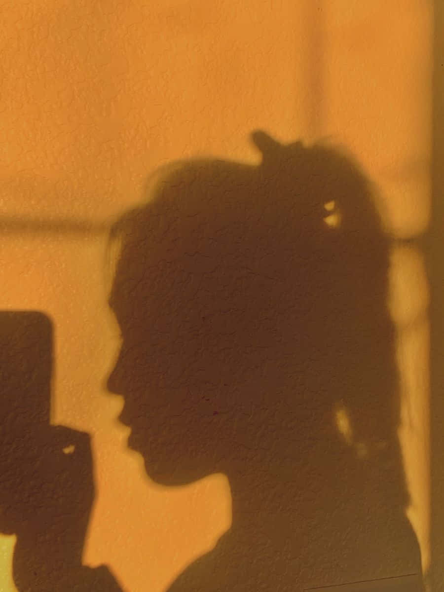 side profile, woman's shadow, textured wall, SD Phone Wallpaper