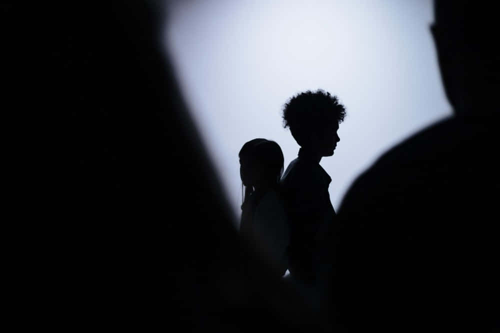 Vulnerable Shadow Children, silhouetted figures, soft glowing sky, SD Desktop Wallpaper