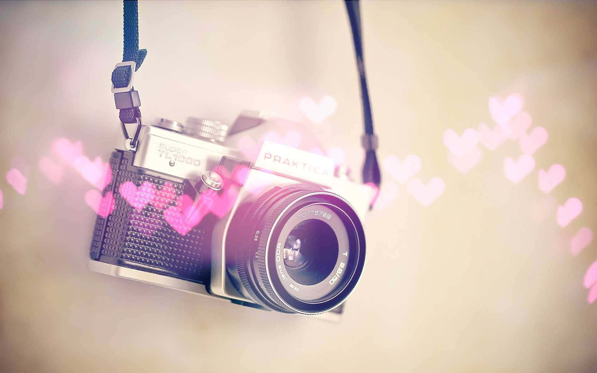vintage silver camera, soft beige background, glowing pink heart bokeh effects, Full HD Desktop Wallpaper