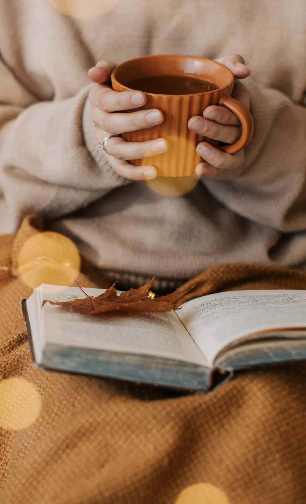 cozy golden lights, warm mug, open book, Full HD Phone Wallpaper