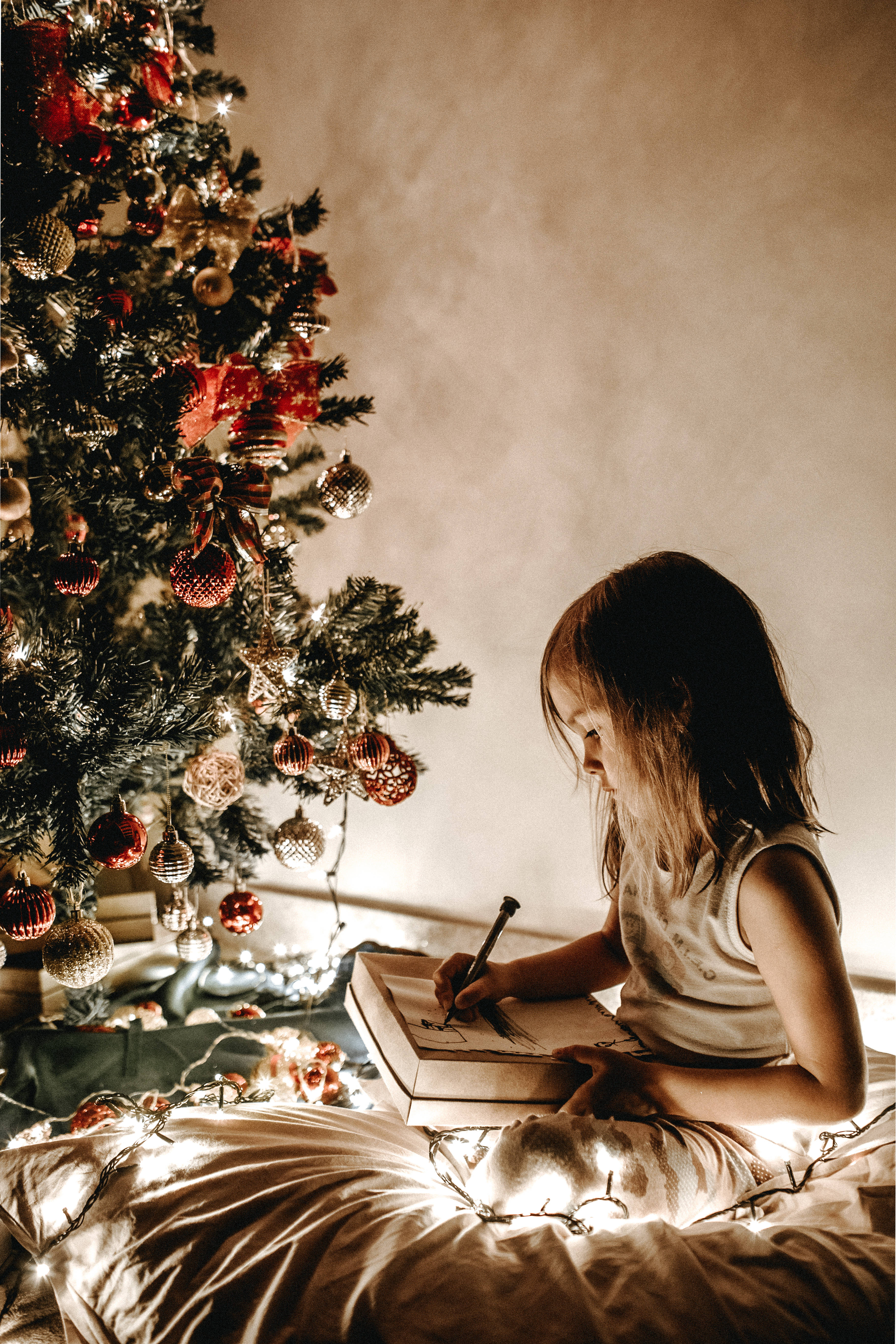 young girl, twinkling fairy lights, decorated Christmas tree, 5K Phone Wallpaper