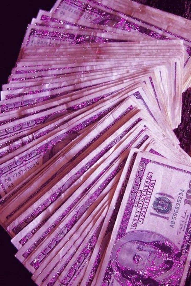 Girly Money, glittery purple-hued $100 bills, dark surface, SD Phone Wallpaper