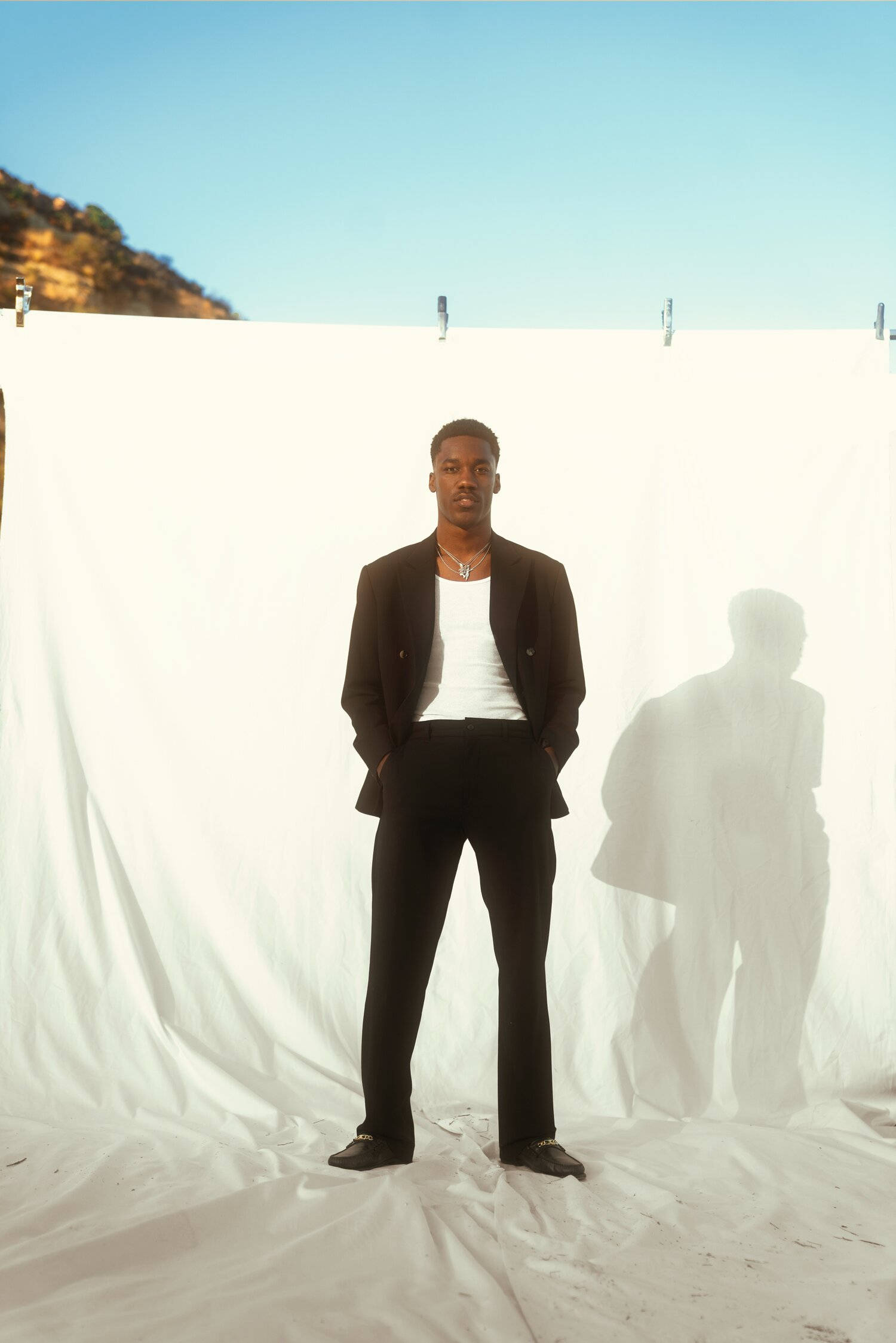 Giveon, black suit, white backdrop, Full HD Phone Wallpaper