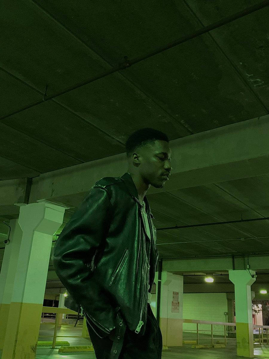 Giveon, black leather jacket, dimly lit underground parking garage, SD Phone Wallpaper
