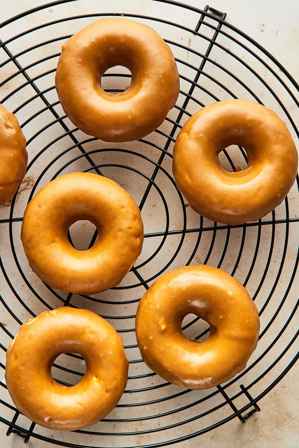 glazed donut, black wire cooling rack, light beige surface, HD Phone Wallpaper