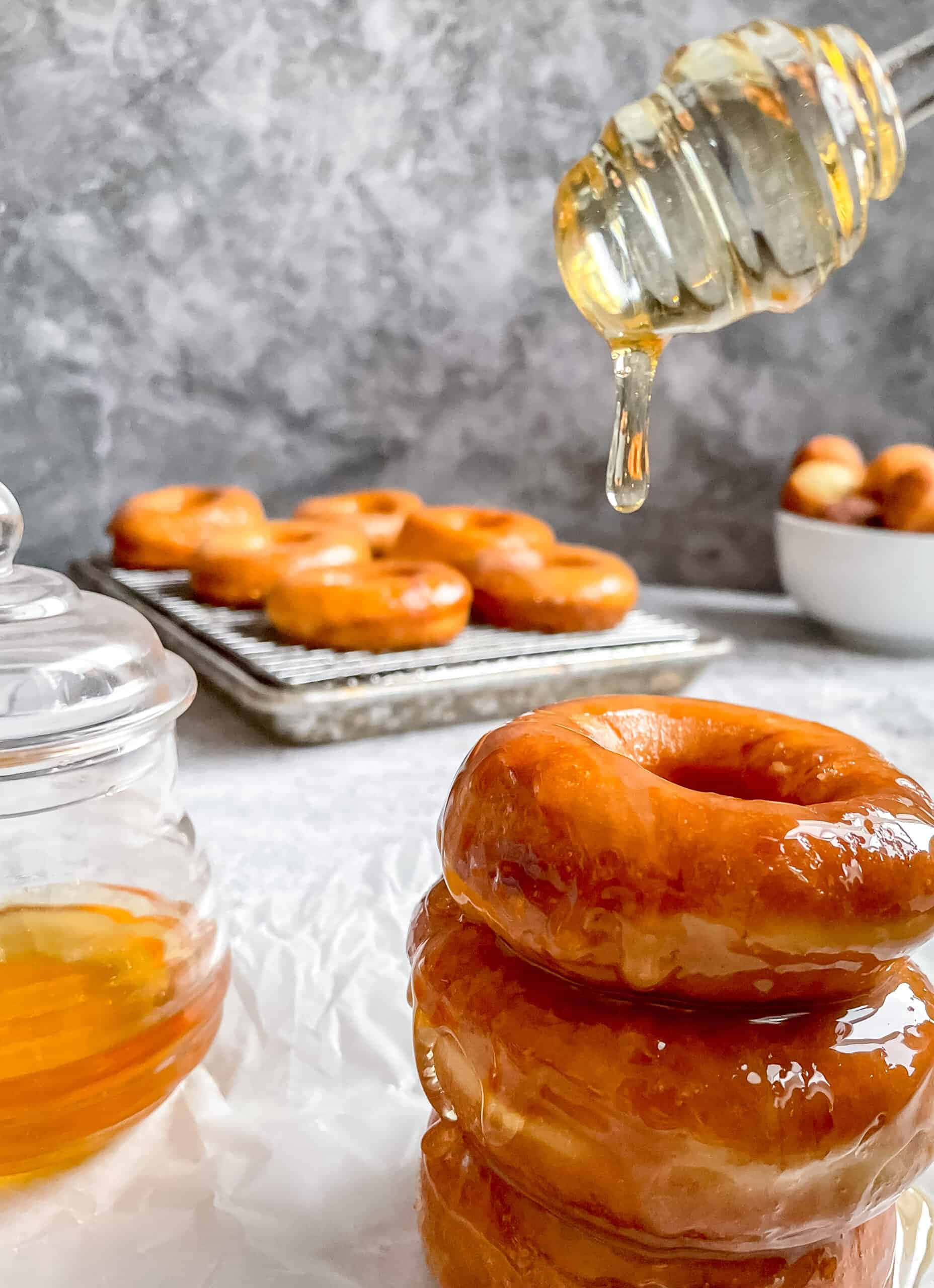 glazed donut, golden glazed donuts, honey dripping from a spoon, 2K Phone Wallpaper