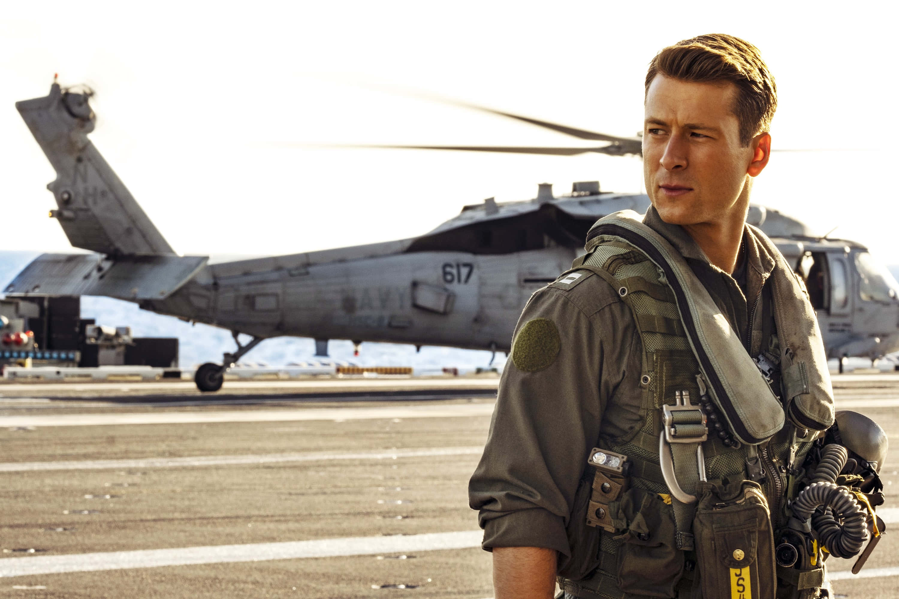 Glen Powell, helicopter, aircraft carrier deck, 2K Desktop Wallpaper