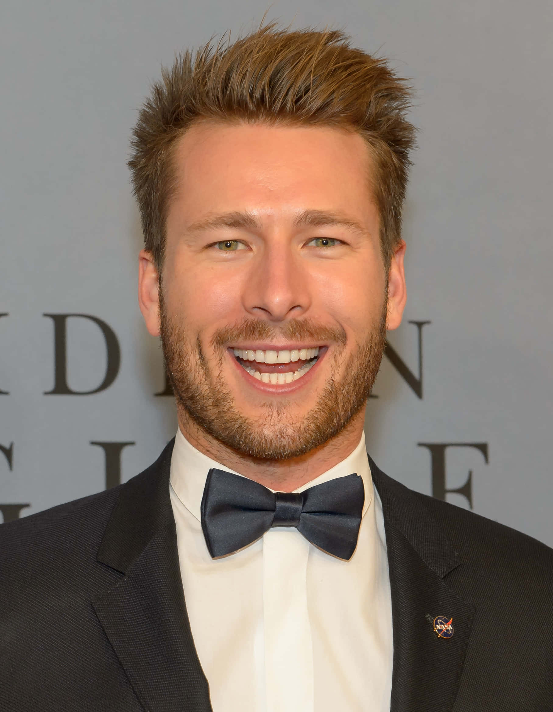 Glen Powell, black tuxedo bow tie, styled brown hair, Full HD Phone Wallpaper