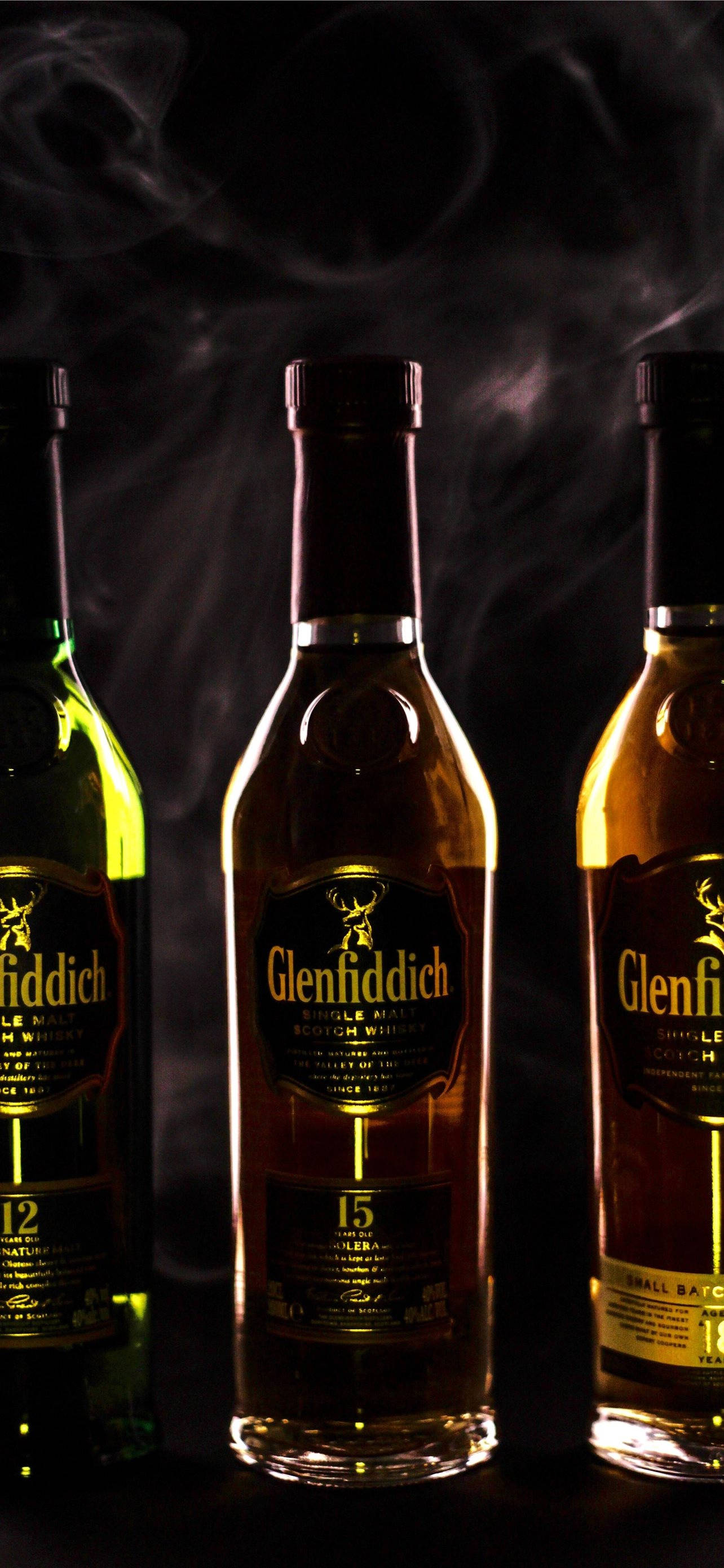 Glenfiddich, whisky bottles, dim lighting, 2K Phone Wallpaper