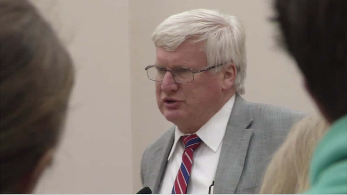 Glenn Grothman, press conference, gray suit, SD Desktop Wallpaper