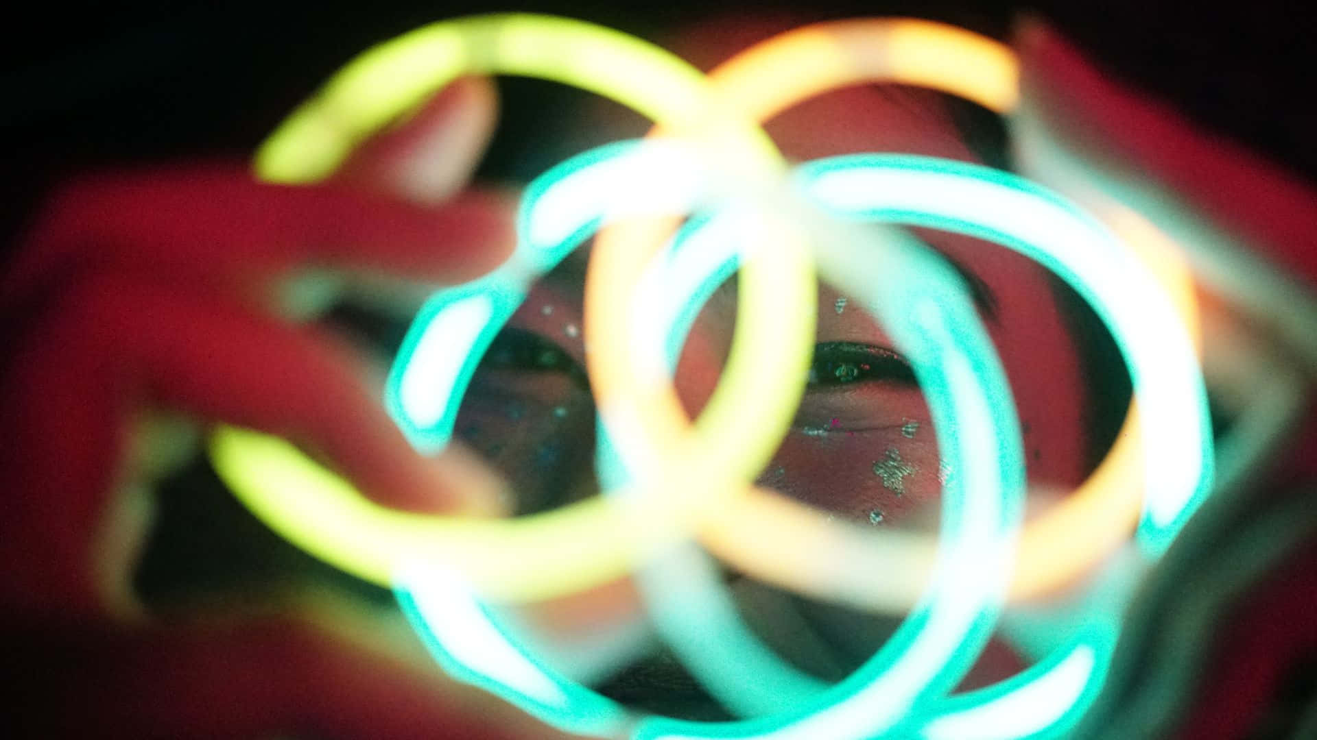 glow in the dark, neon bracelets, vibrant cyan yellow and orange hues, Full HD Desktop Wallpaper