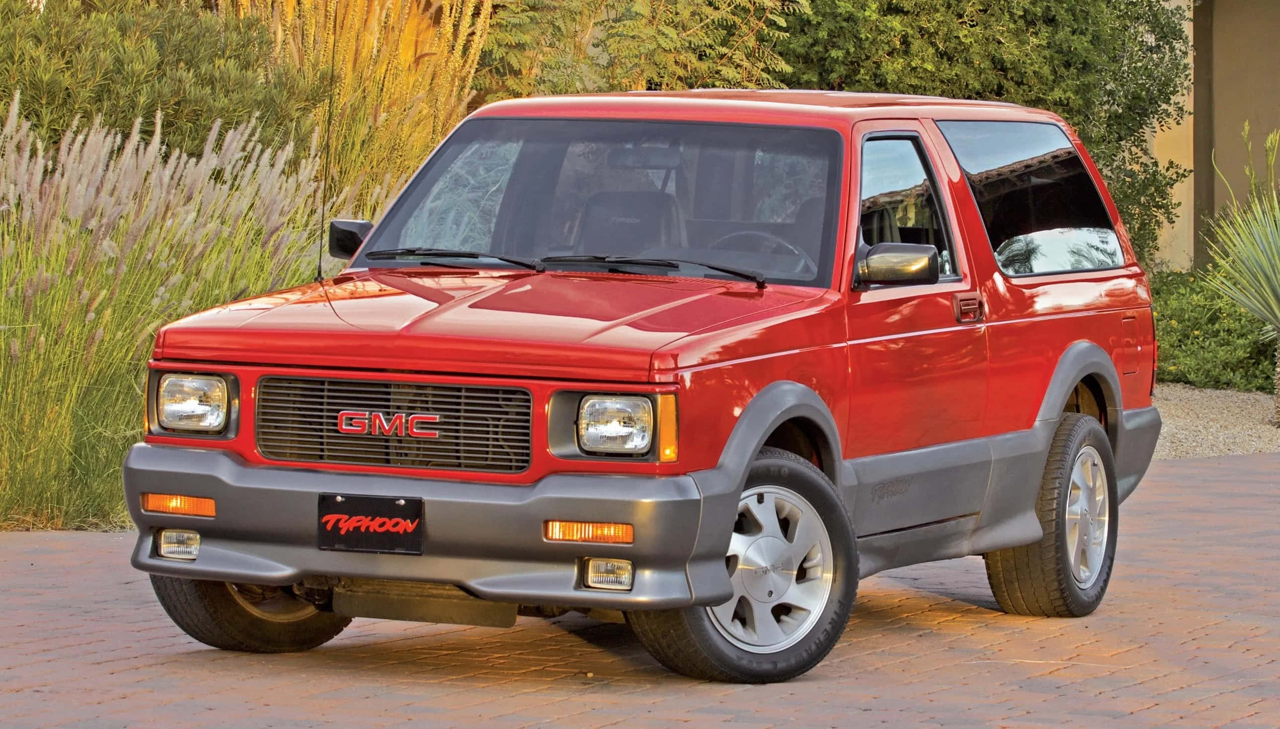 GMC Typhoon, red, brick driveway, 2K Desktop Wallpaper