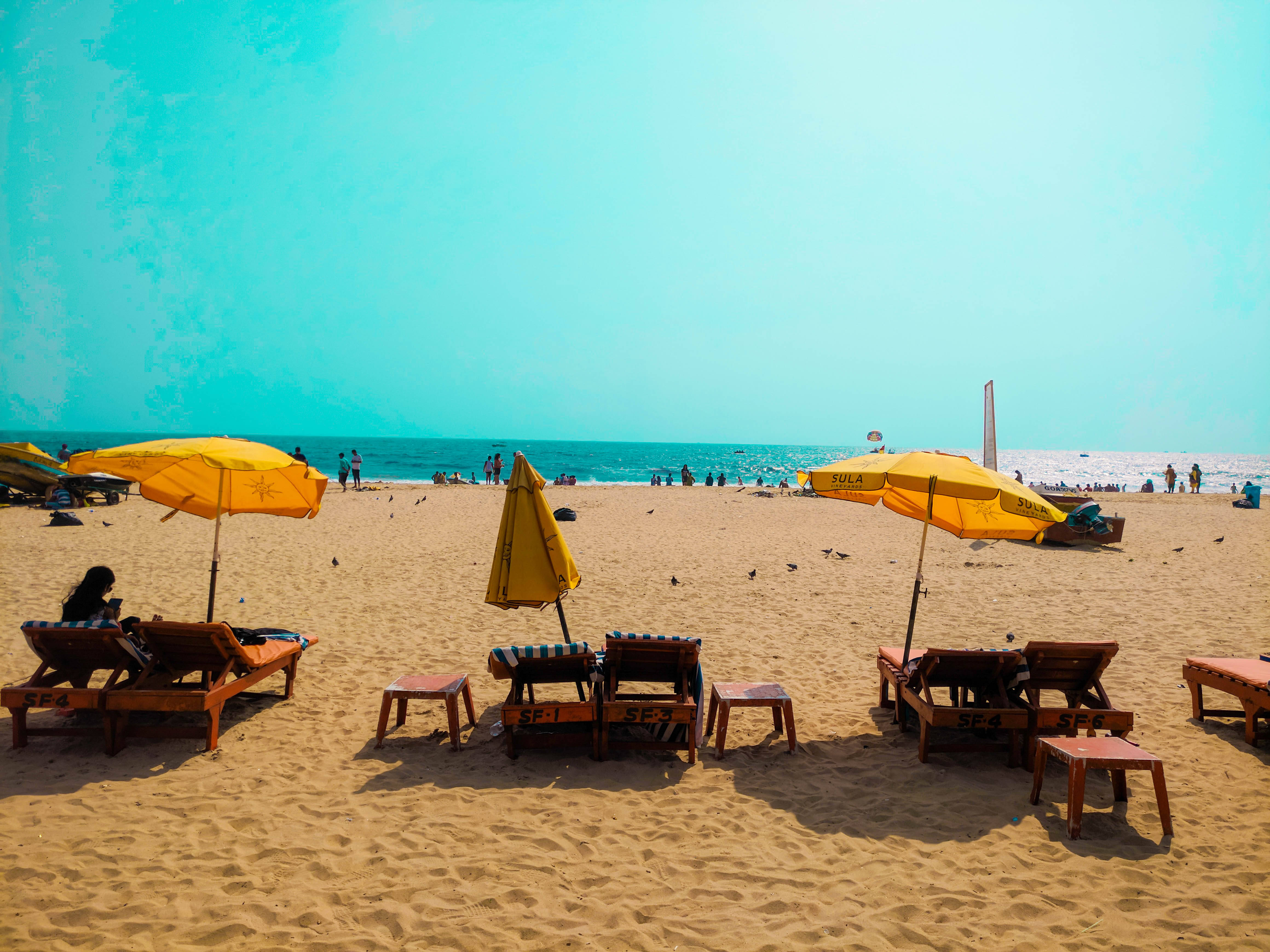 Goa India, yellow umbrellas, wooden lounge chairs, 4K Desktop Wallpaper