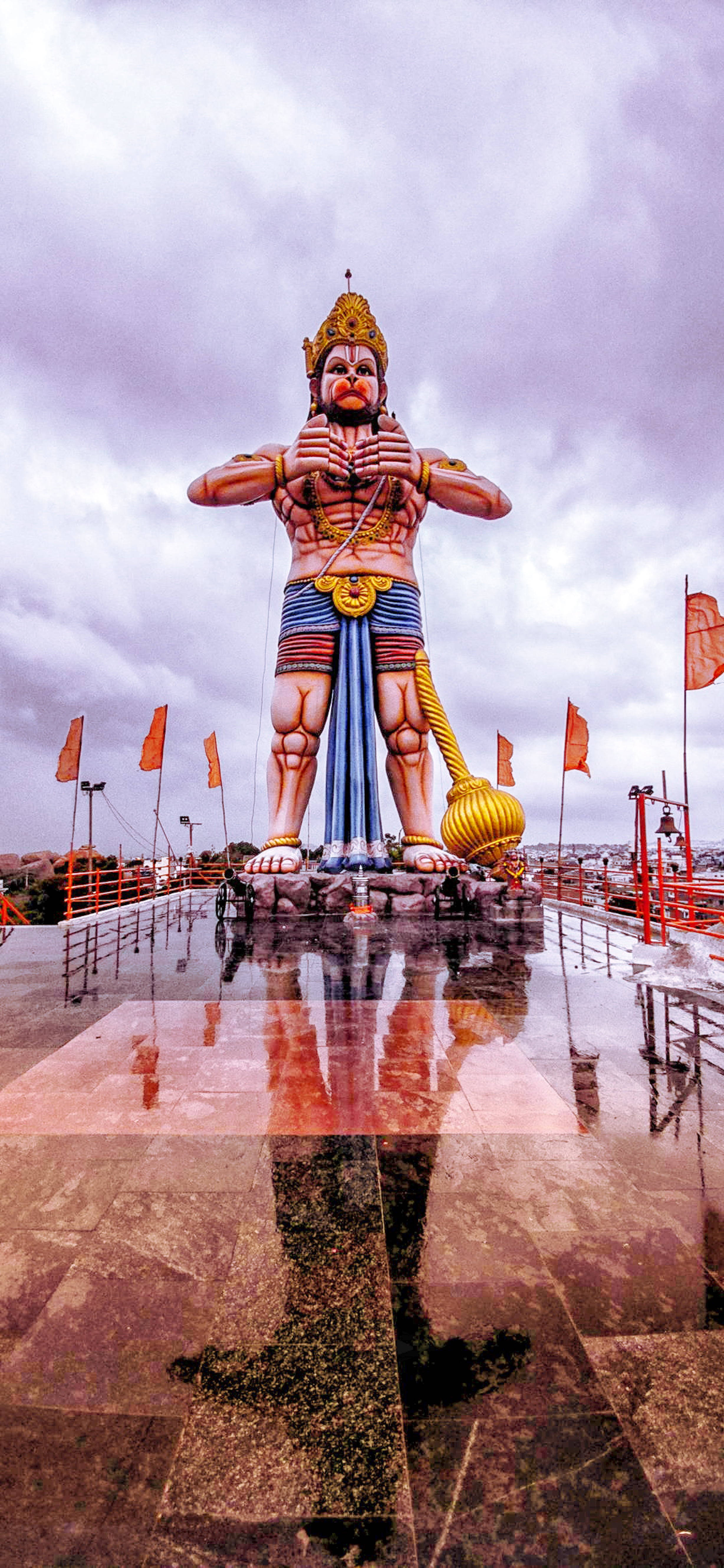 God Hanuman, towering statue, wet platform, 5K Phone Wallpaper