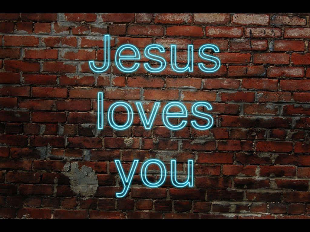 Jesus loves you, glowing blue neon sign, weathered red brick wall, SD Desktop Wallpaper