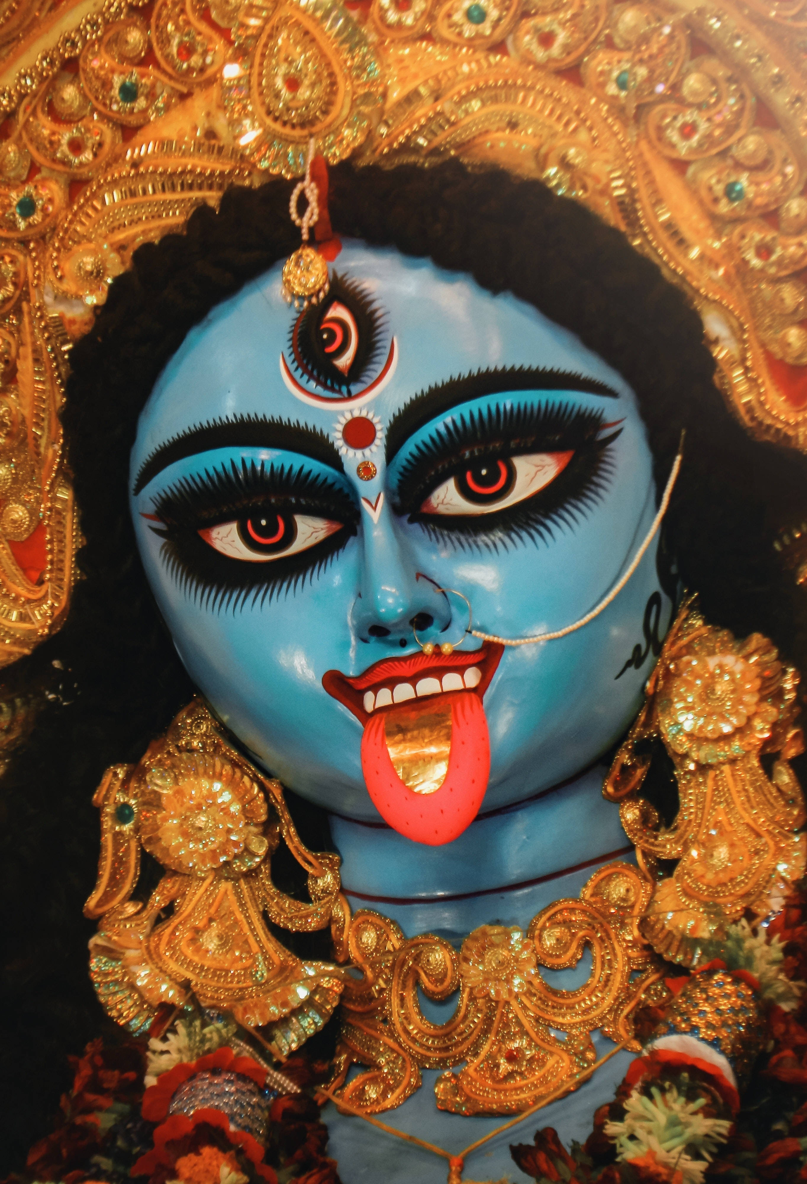 Goddess Kali, blue-skinned, golden jewelry, 4K Phone Wallpaper