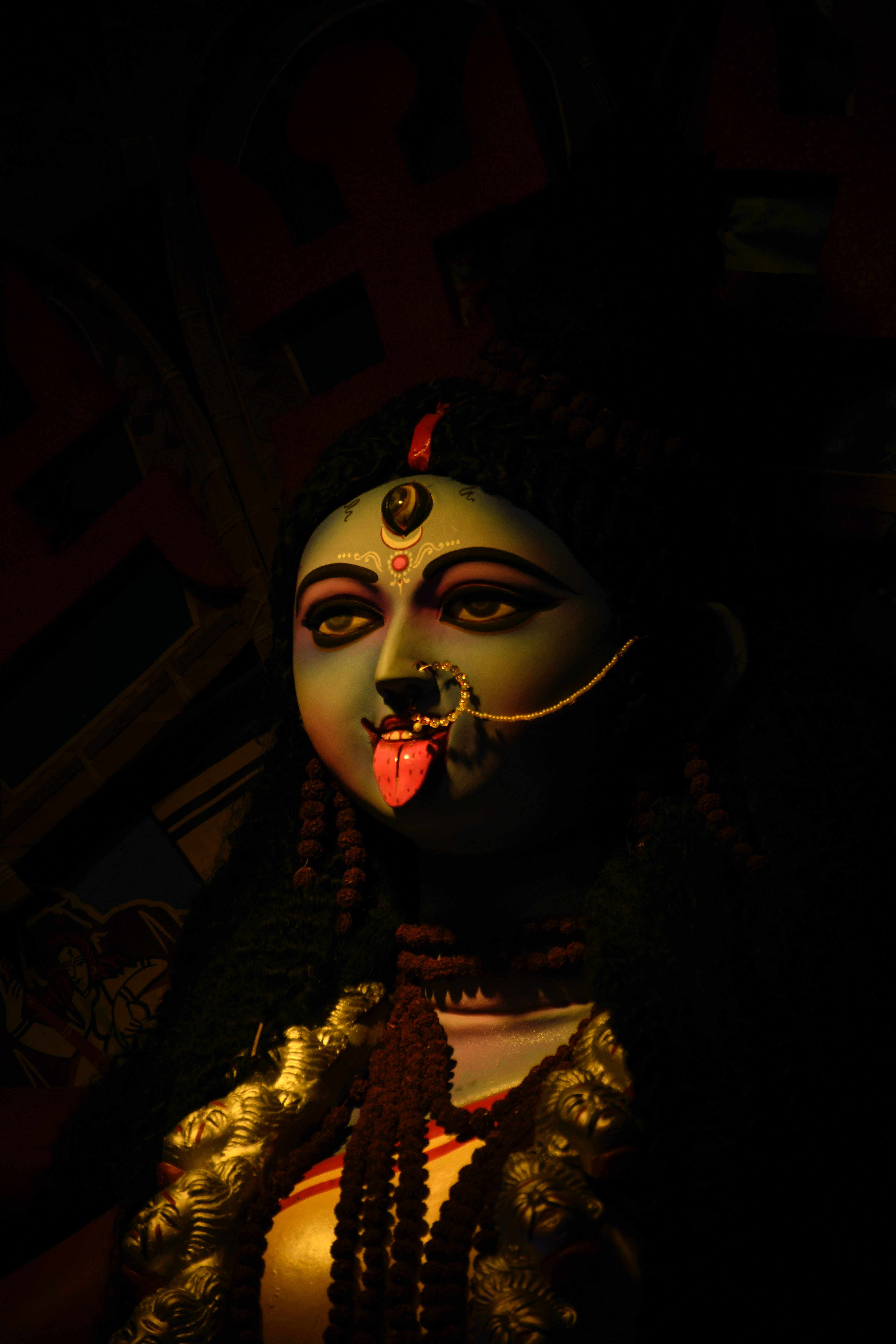 Goddess Kali, dark-skinned, glowing eyes, 5K Phone Wallpaper