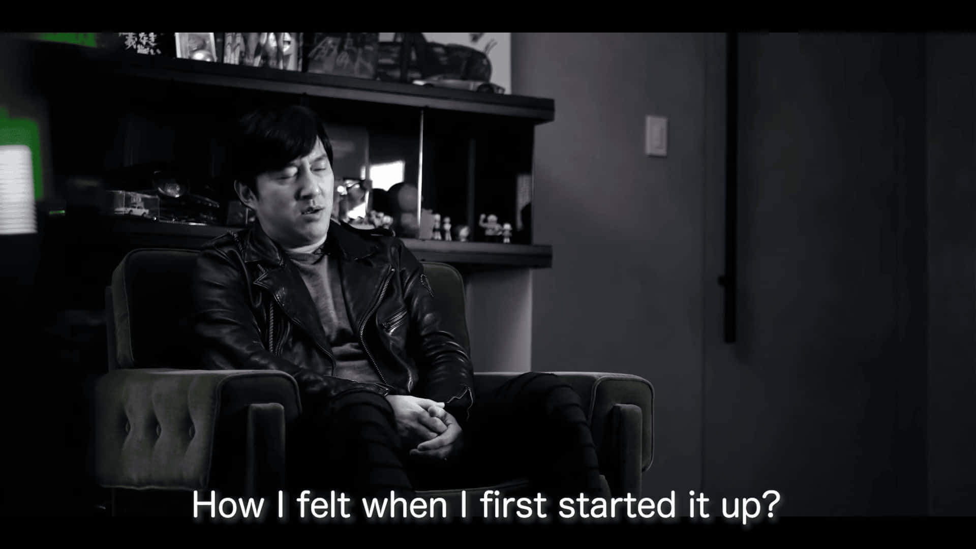 Goichi Suda, leather jacket, dimly lit room, Full HD Desktop Wallpaper