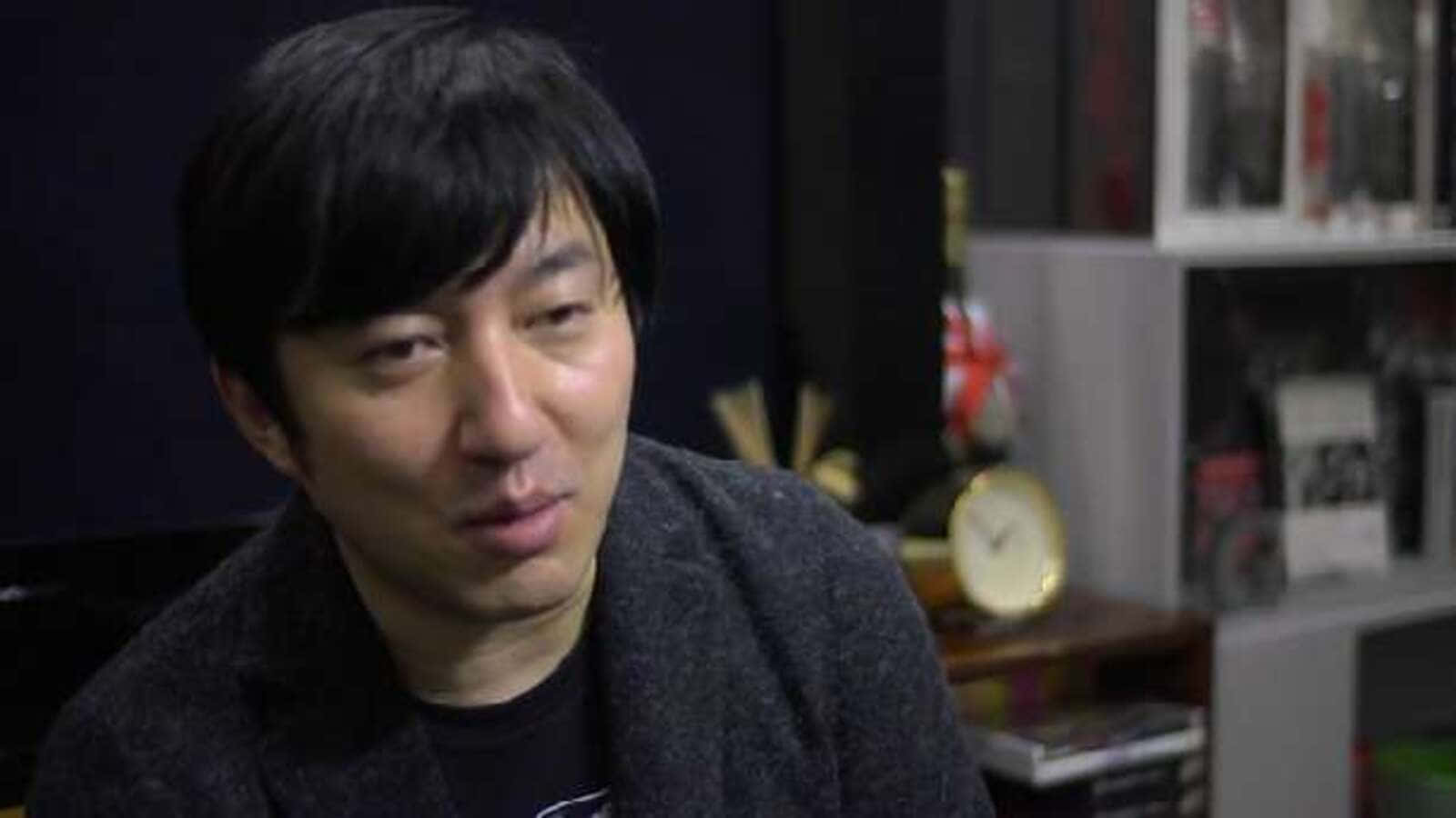 Goichi Suda, gray sweater, blurred background, HD Desktop Wallpaper