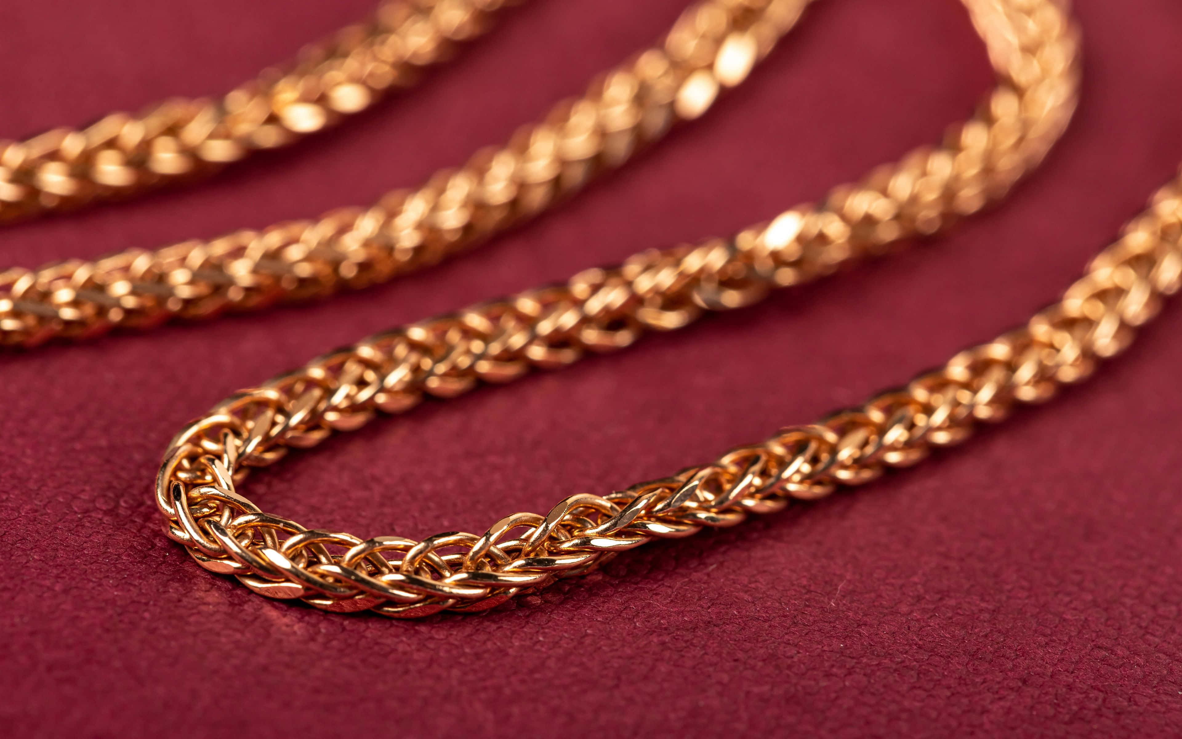 gold chain, golden braided chain necklace, deep burgundy textured surface, 4K Desktop Wallpaper