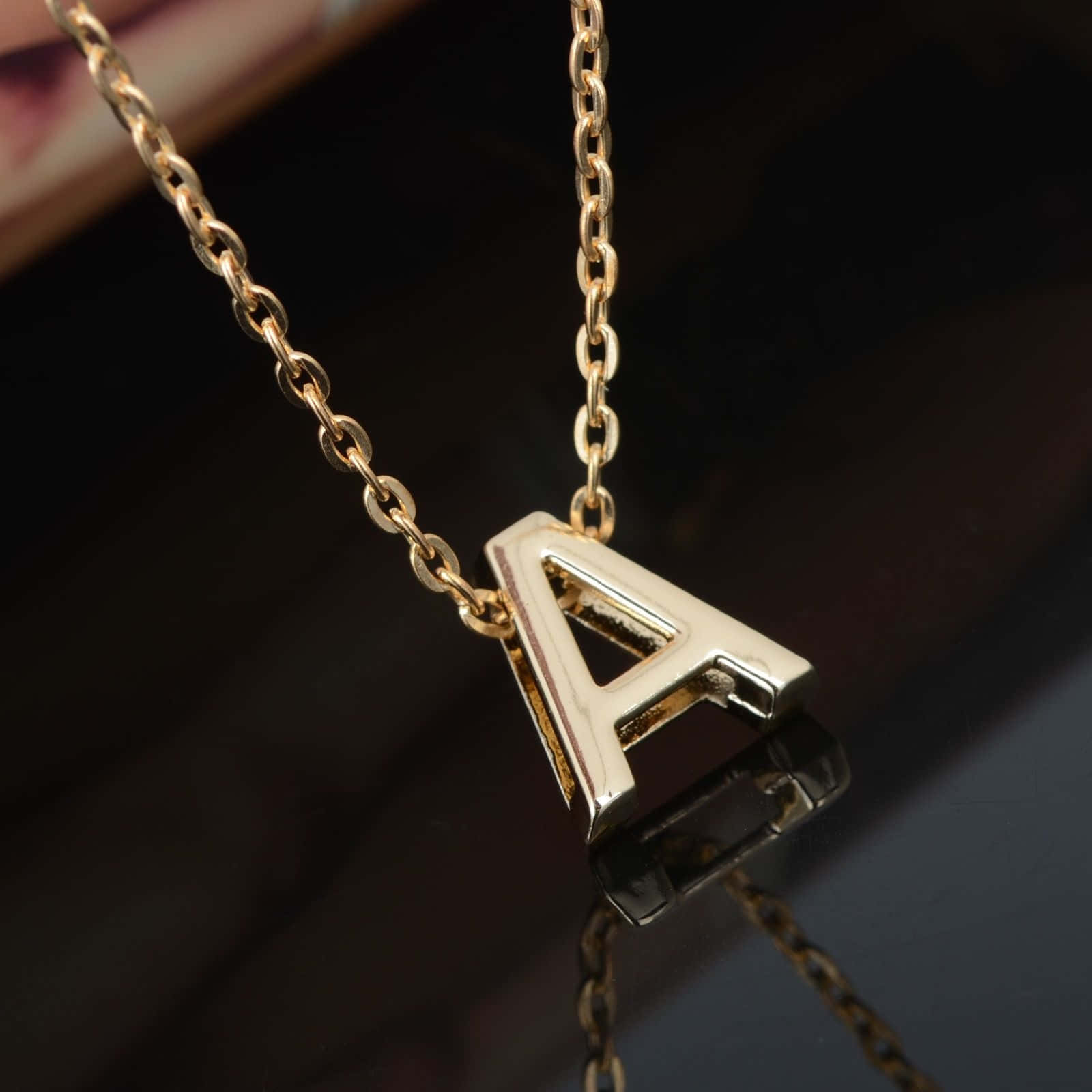 gold chain, letter A pendant, dark reflective surface, HD Desktop Wallpaper