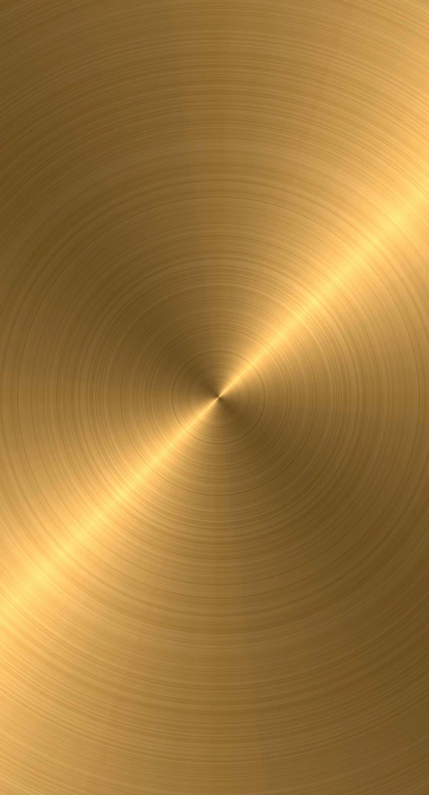 Gold iPhone, concentric brushed metal lines, radiant golden surface, 2K Phone Wallpaper