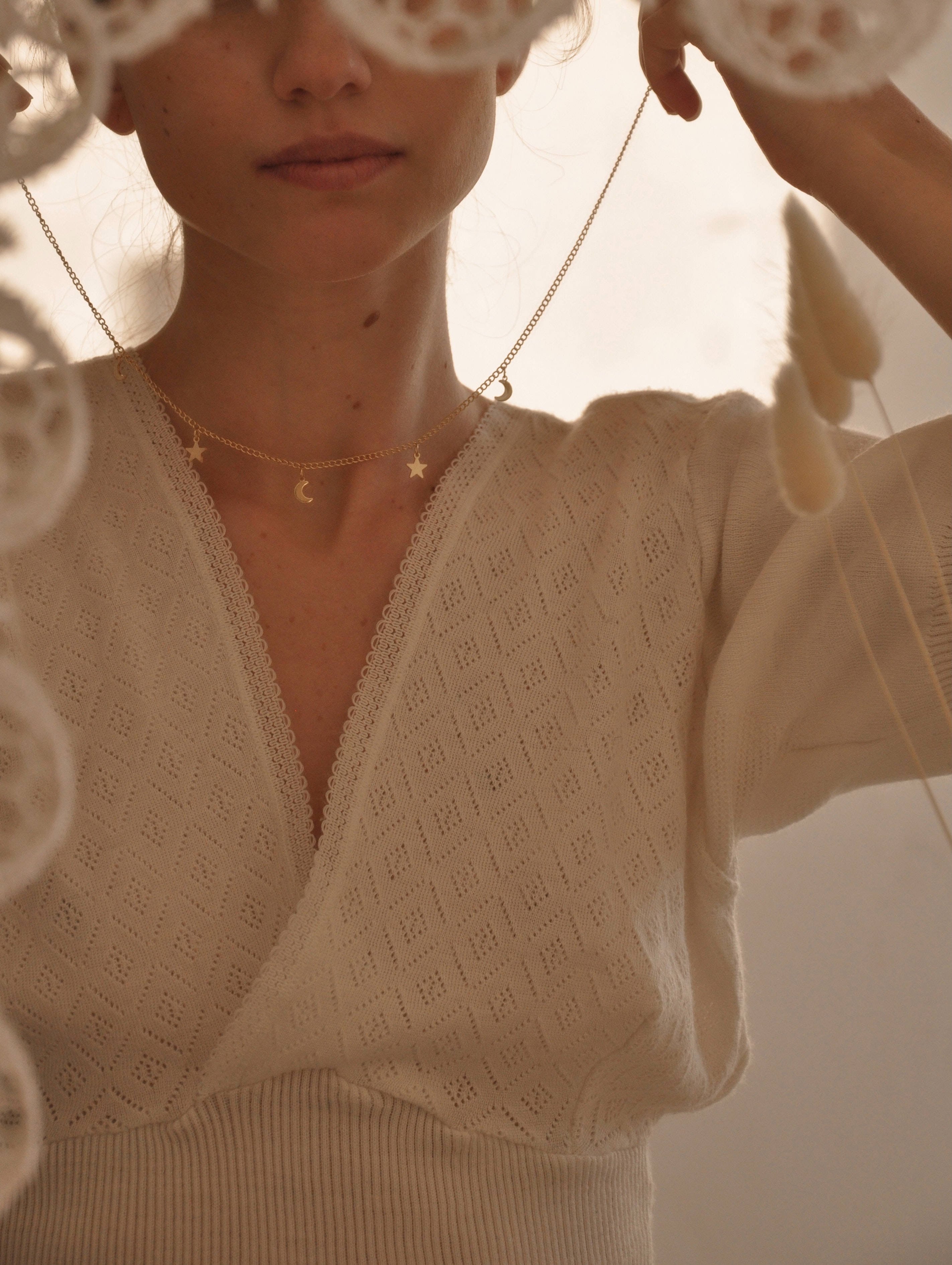 cream knit top, delicate white lace, soft golden light, 2K Phone Wallpaper