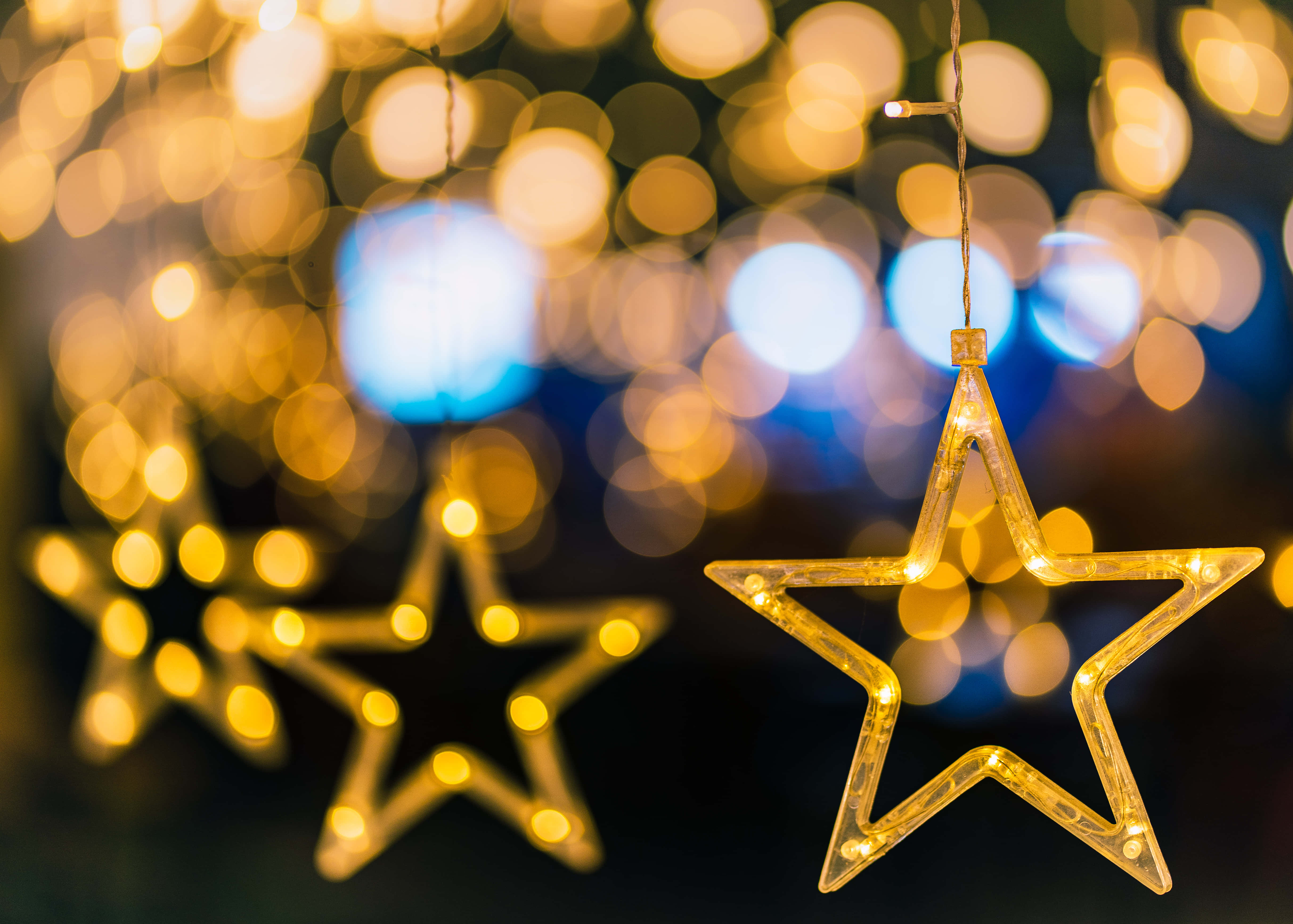 gold stars, Christmas star decorations, glowing star-shaped string lights, 5K Desktop Wallpaper