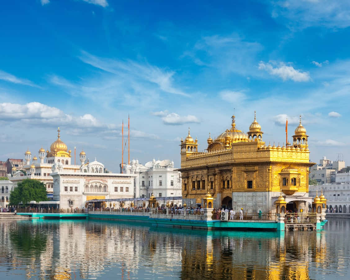 Golden Temple, green-lined causeway, bright blue sky, SD Desktop Wallpaper