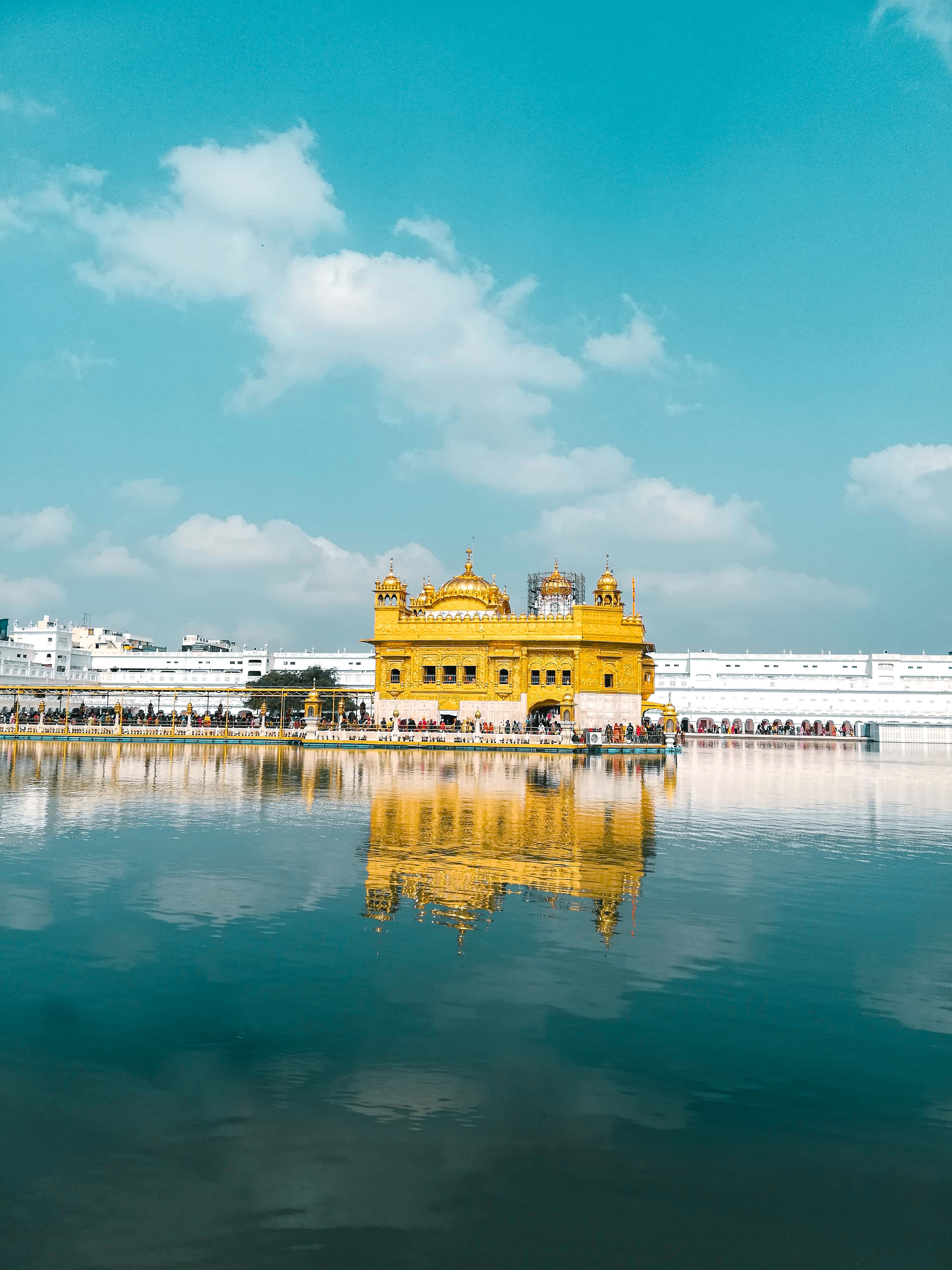 Golden Temple, bright blue sky, fluffy clouds, 4K Phone Wallpaper