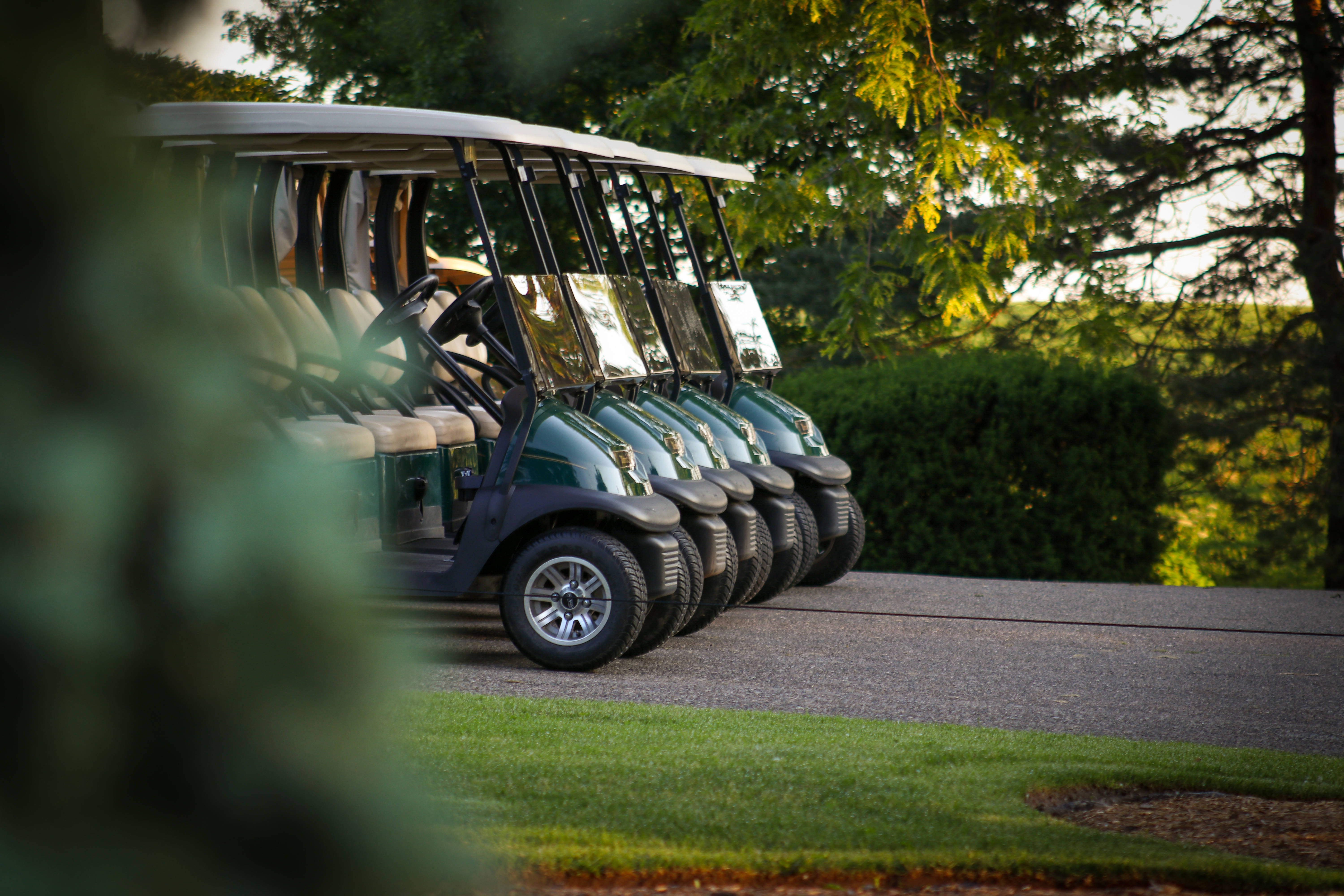 golf course carts, paved path, lush green grass, 5K Desktop Wallpaper