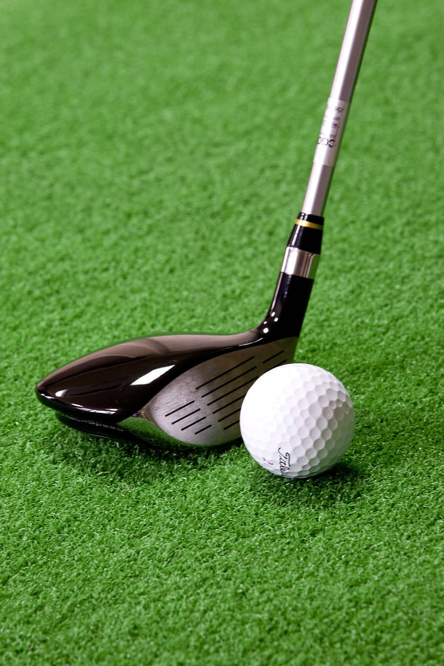 sleek black golf driver, white golf ball, vibrant green artificial turf, HD Phone Wallpaper