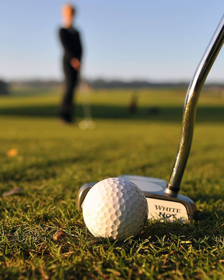 white golf ball, putter blade, vibrant green grass, SD Phone Wallpaper