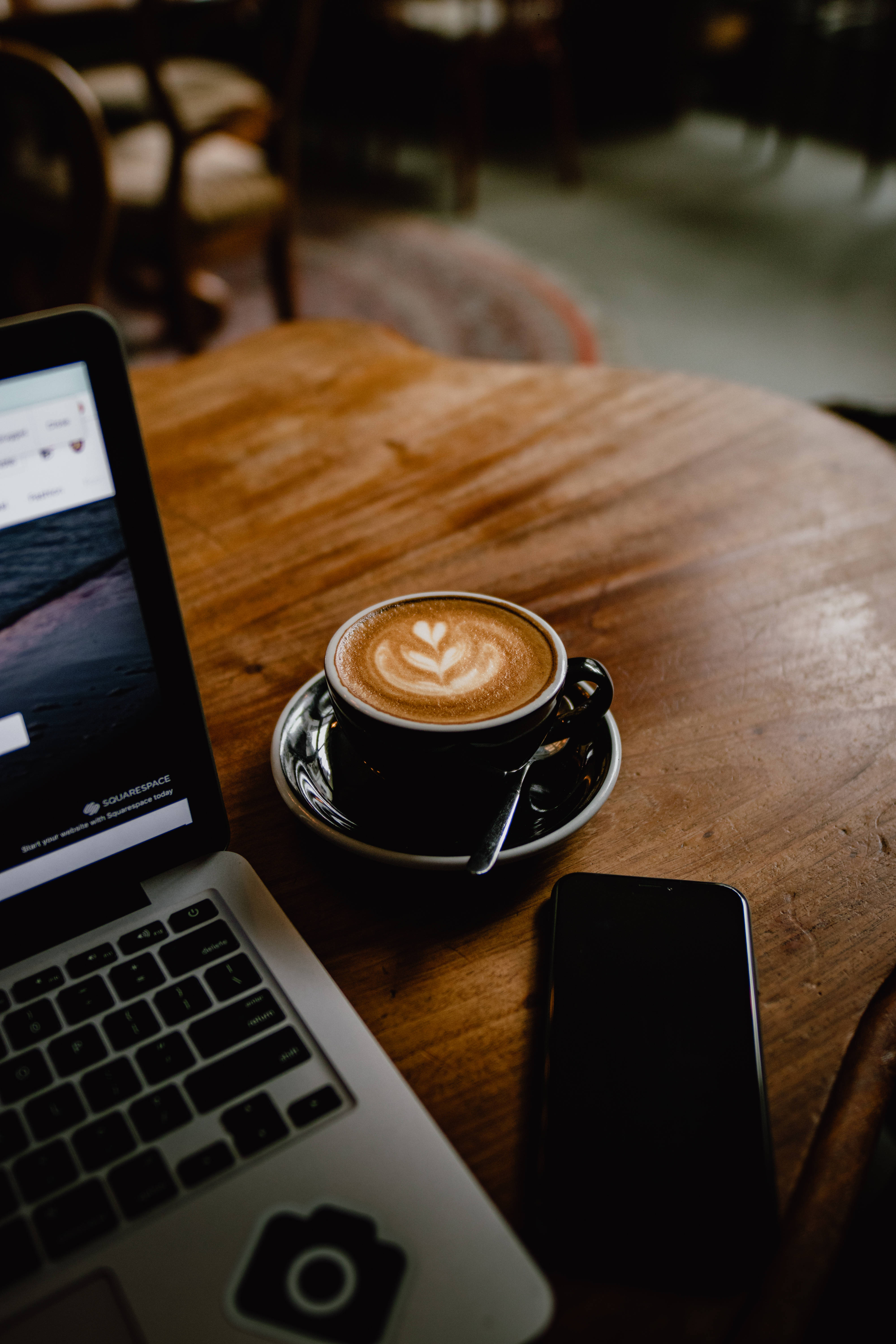 heart latte art, rustic wooden table, dimly lit cafe, 5K Phone Wallpaper