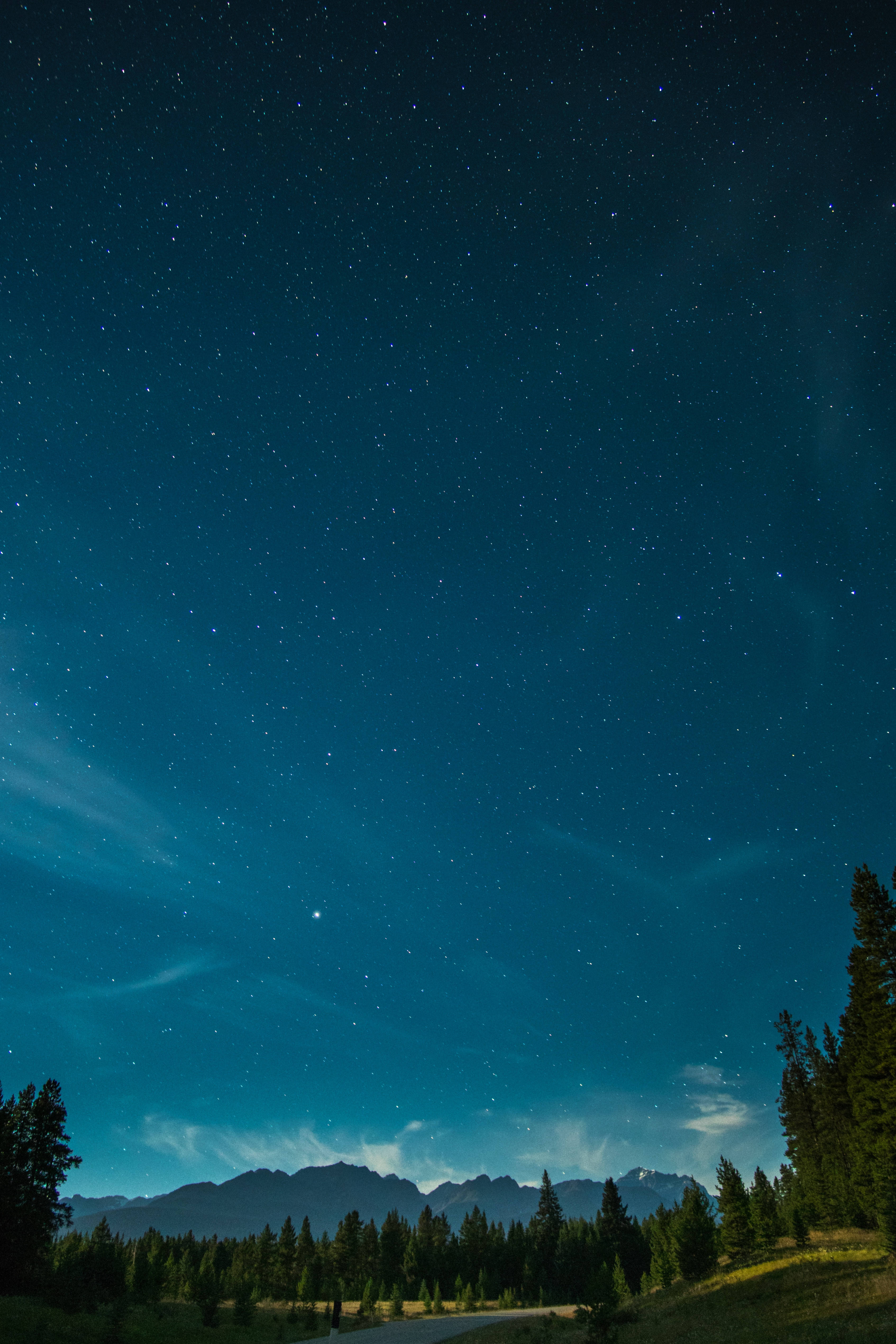 starry night, glowing auroras, dark mountain range, 4K Phone Wallpaper