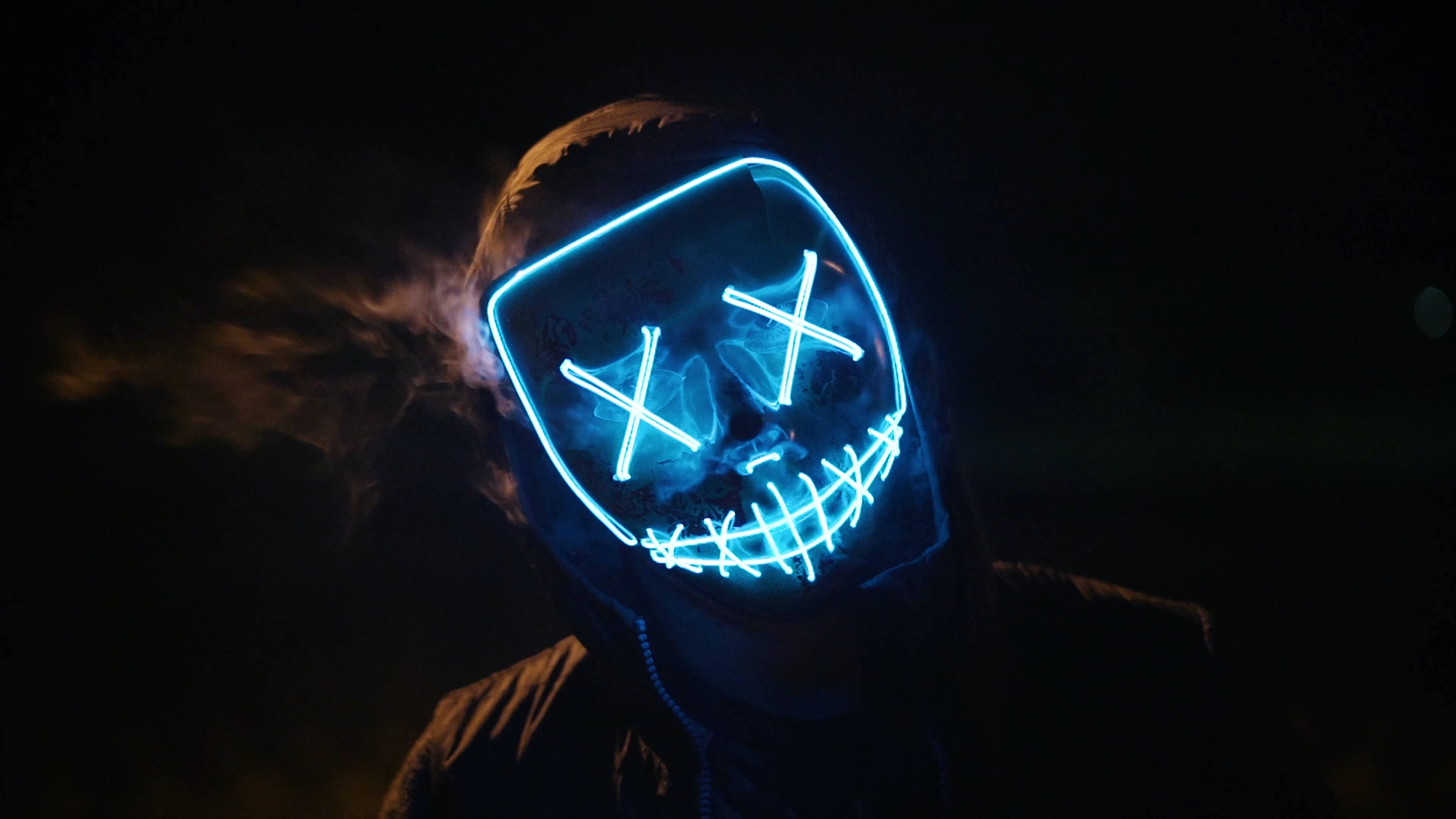 glowing blue LED mask, X eyes, stitched mouth, 4K Desktop Wallpaper