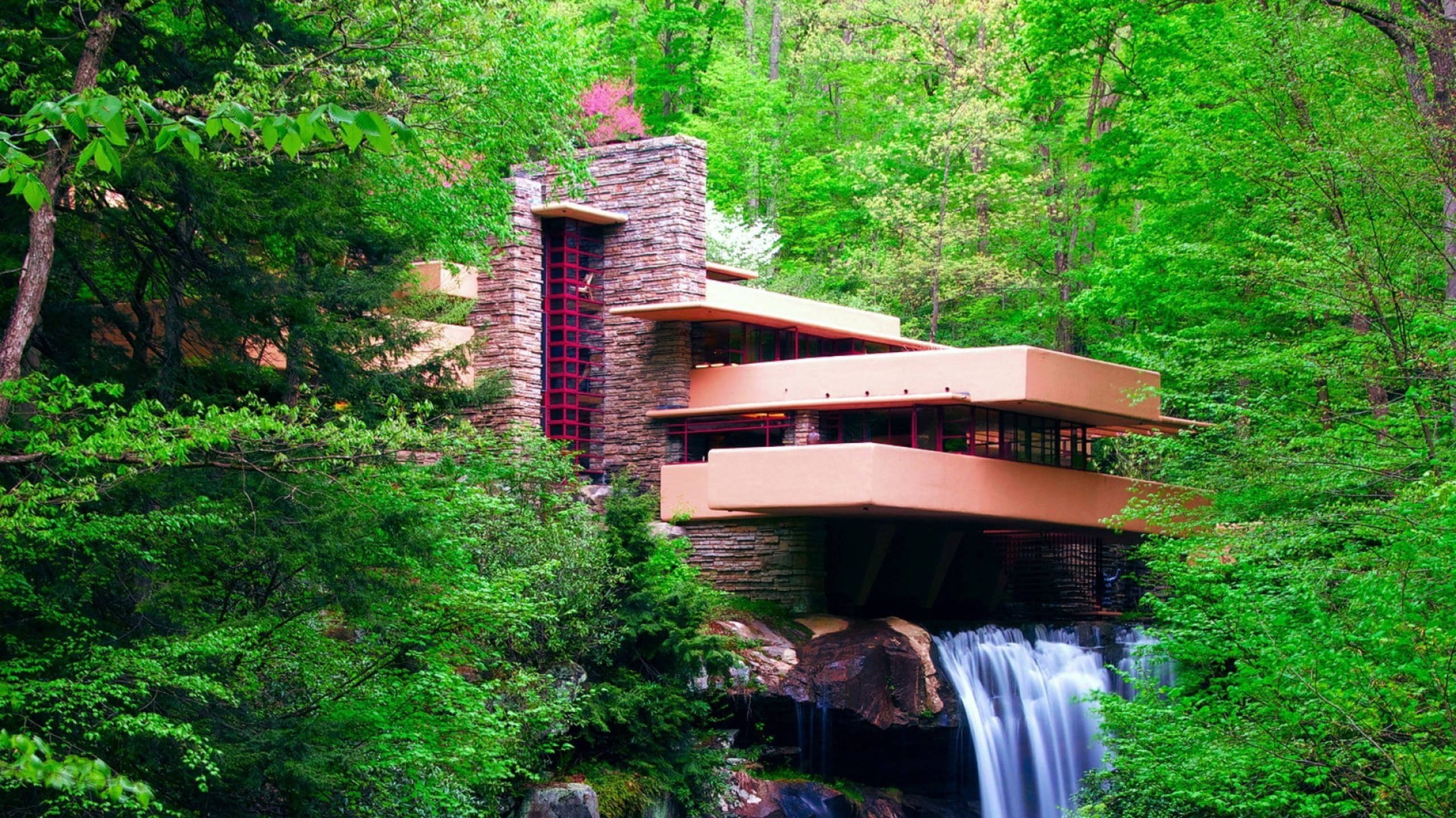 modernist stone and concrete house, terraced balconies, lush green forest, 2K Desktop Wallpaper