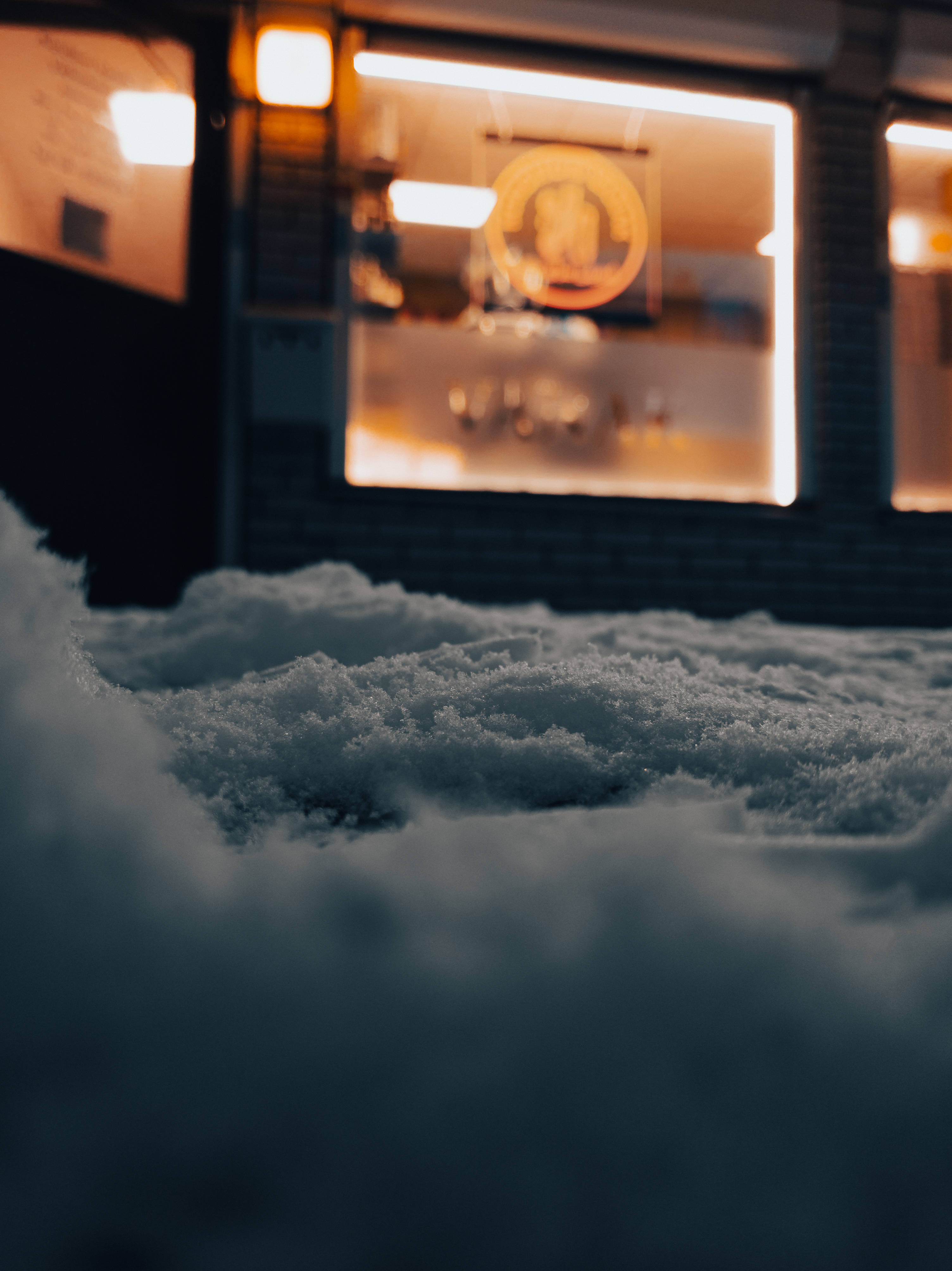 Google Pixel 3, snowy ground, warmly lit storefront window, 4K Phone Wallpaper