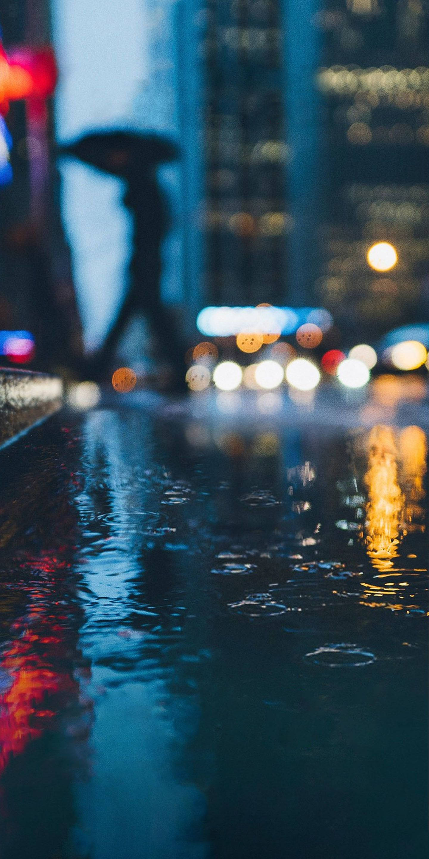 Google Pixel, rainy night cityscape, blurred lights, 2K Phone Wallpaper