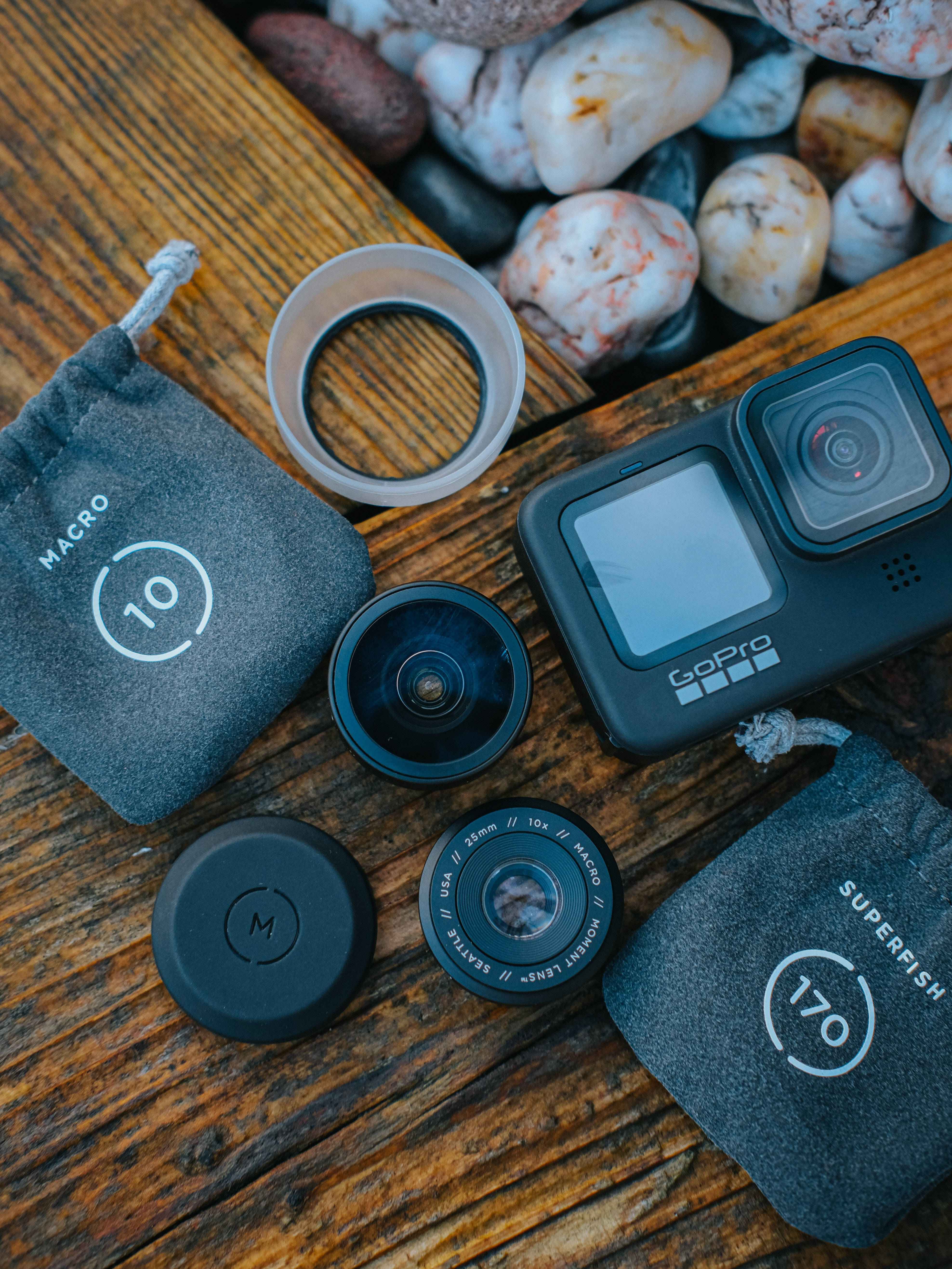GoPro, macro superfish lenses, rustic wooden surface, 5K Phone Wallpaper
