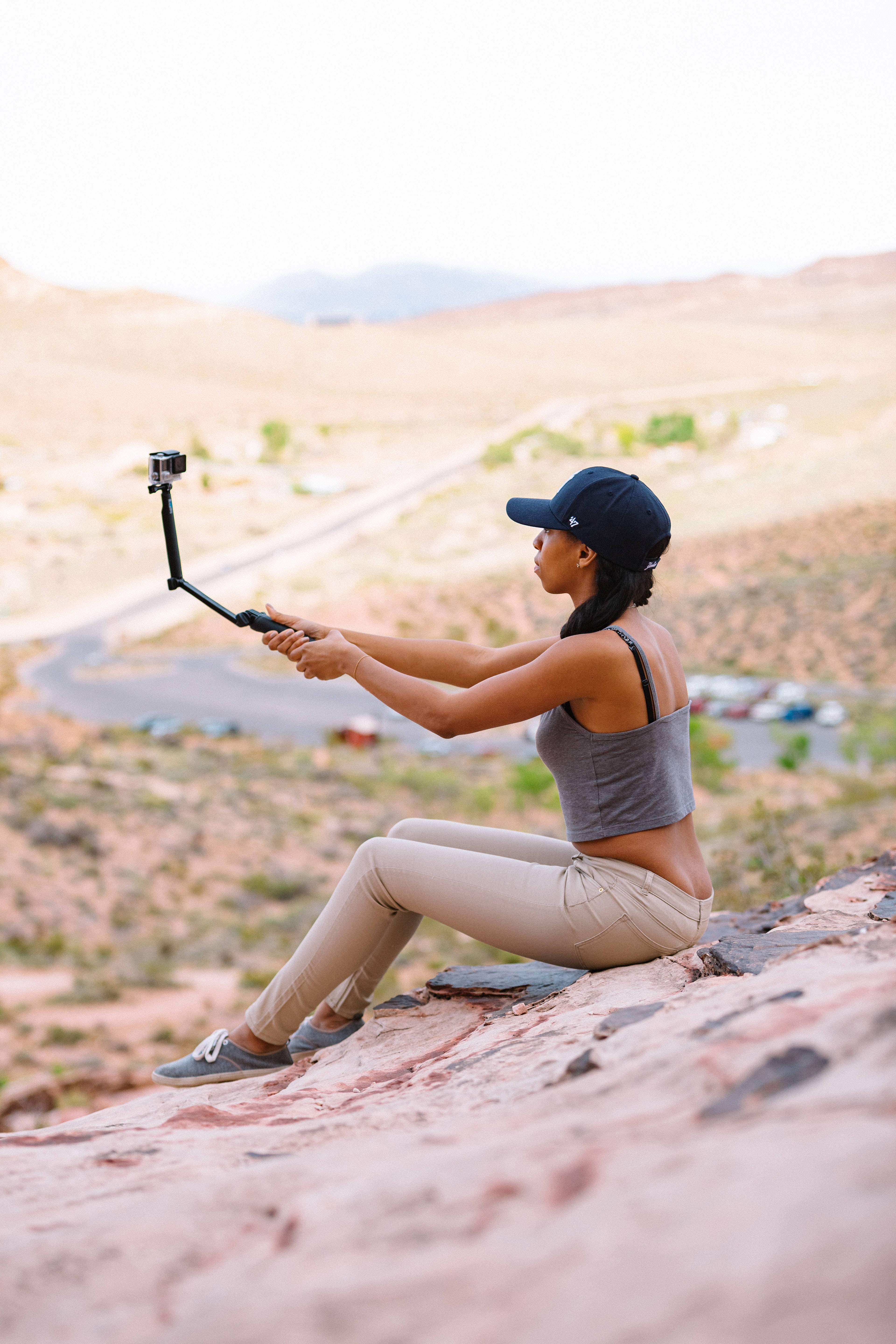 GoPro, lady hiker, red rock cliff, 5K Phone Wallpaper