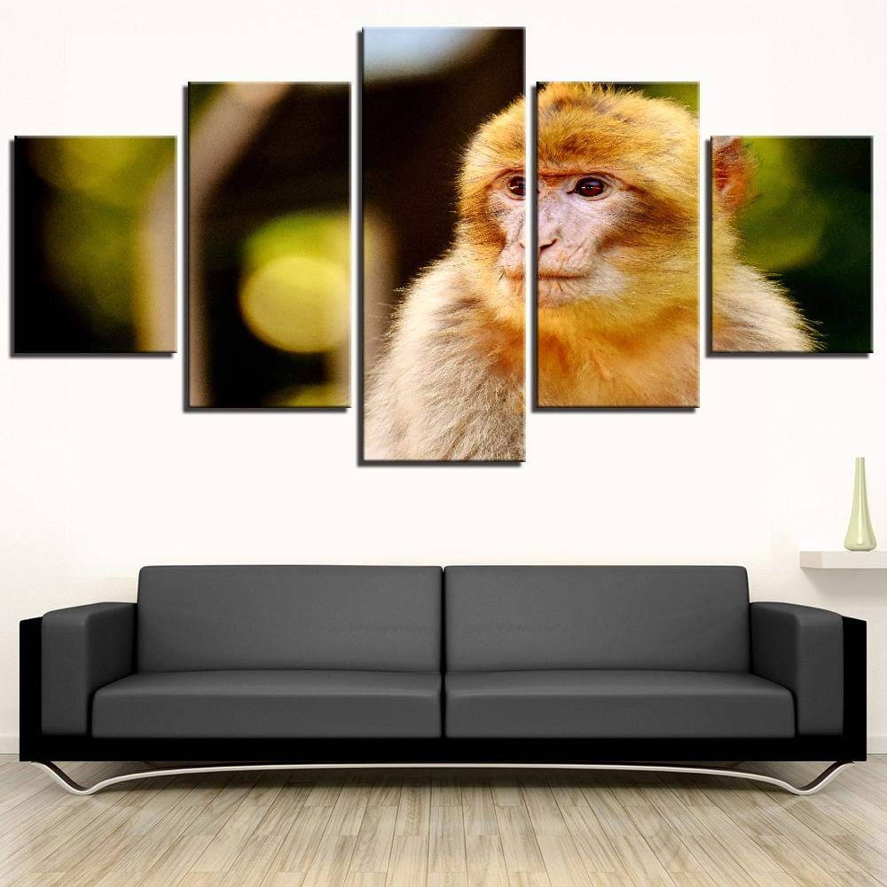 golden-furred monkey, multi-panel canvas, sleek black sofa, SD Desktop Wallpaper