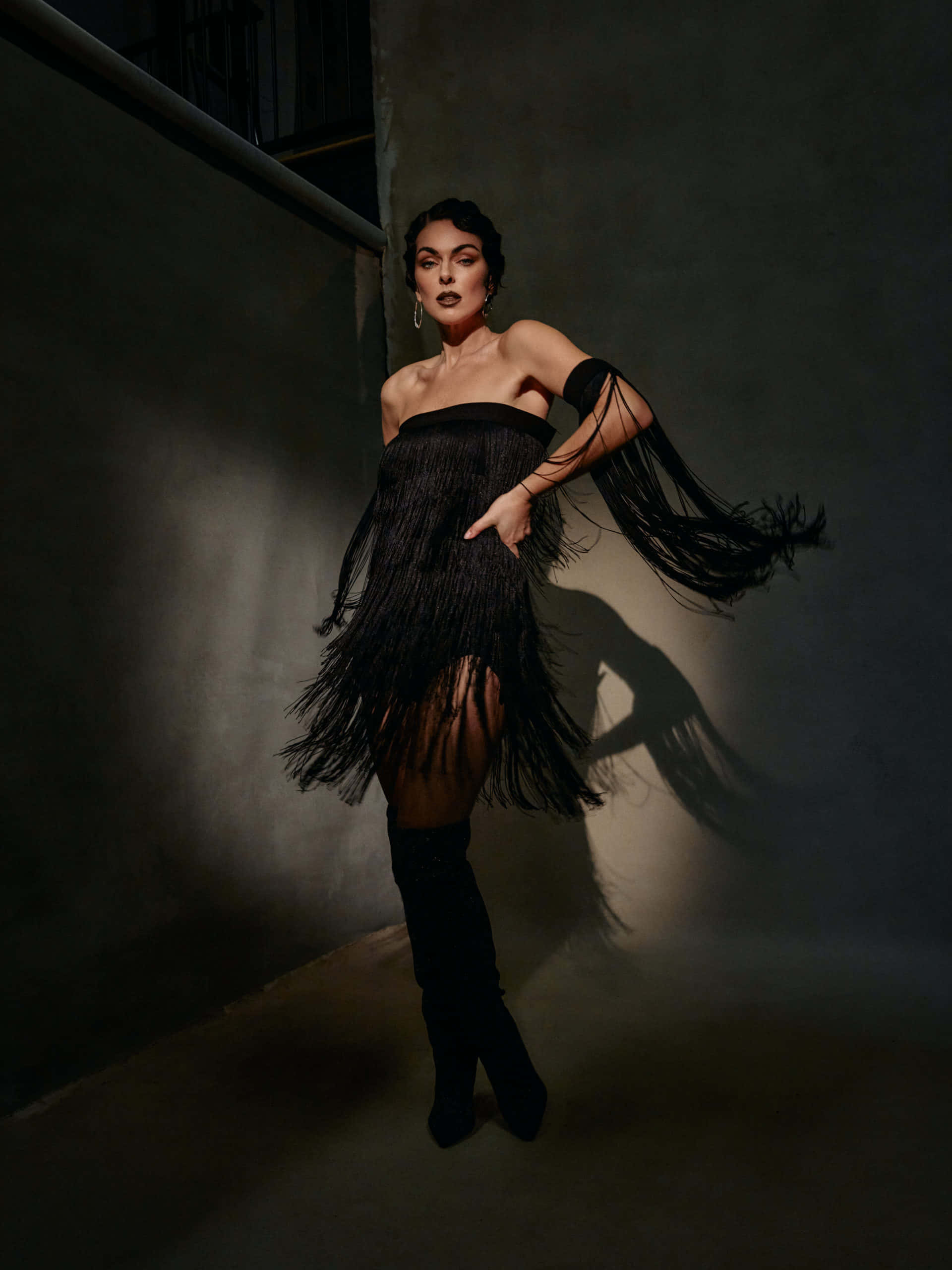 black fringe dress, thigh-high boots, dimly lit alley, 2K Phone Wallpaper