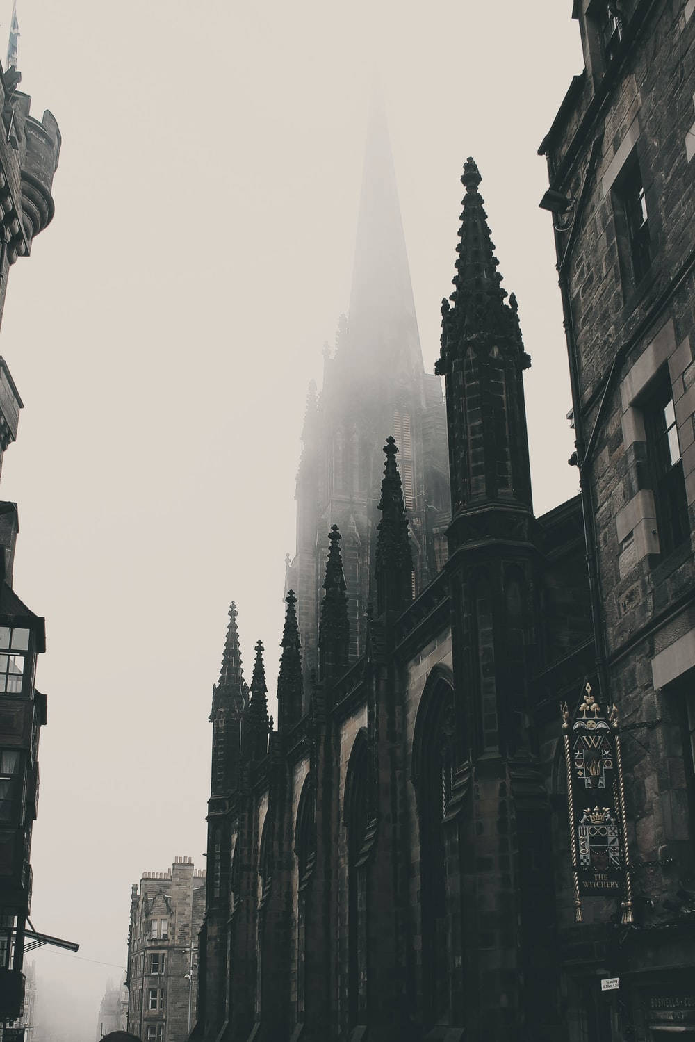 gothic cathedral spire, foggy sky, historic stone buildings, HD Phone Wallpaper