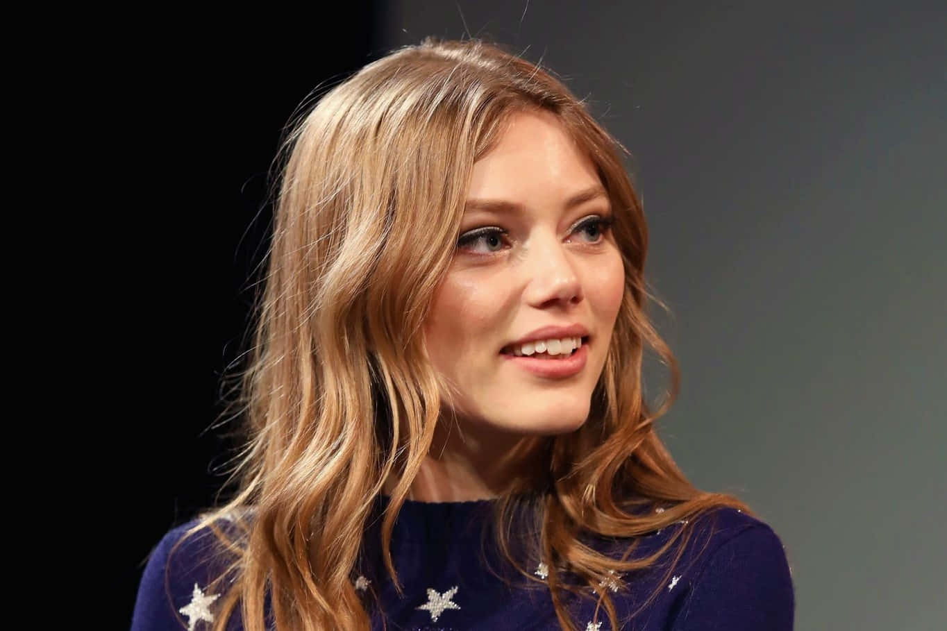 Grace Van Dien, wavy blonde hair, star-patterned navy sweater, HD Desktop Wallpaper