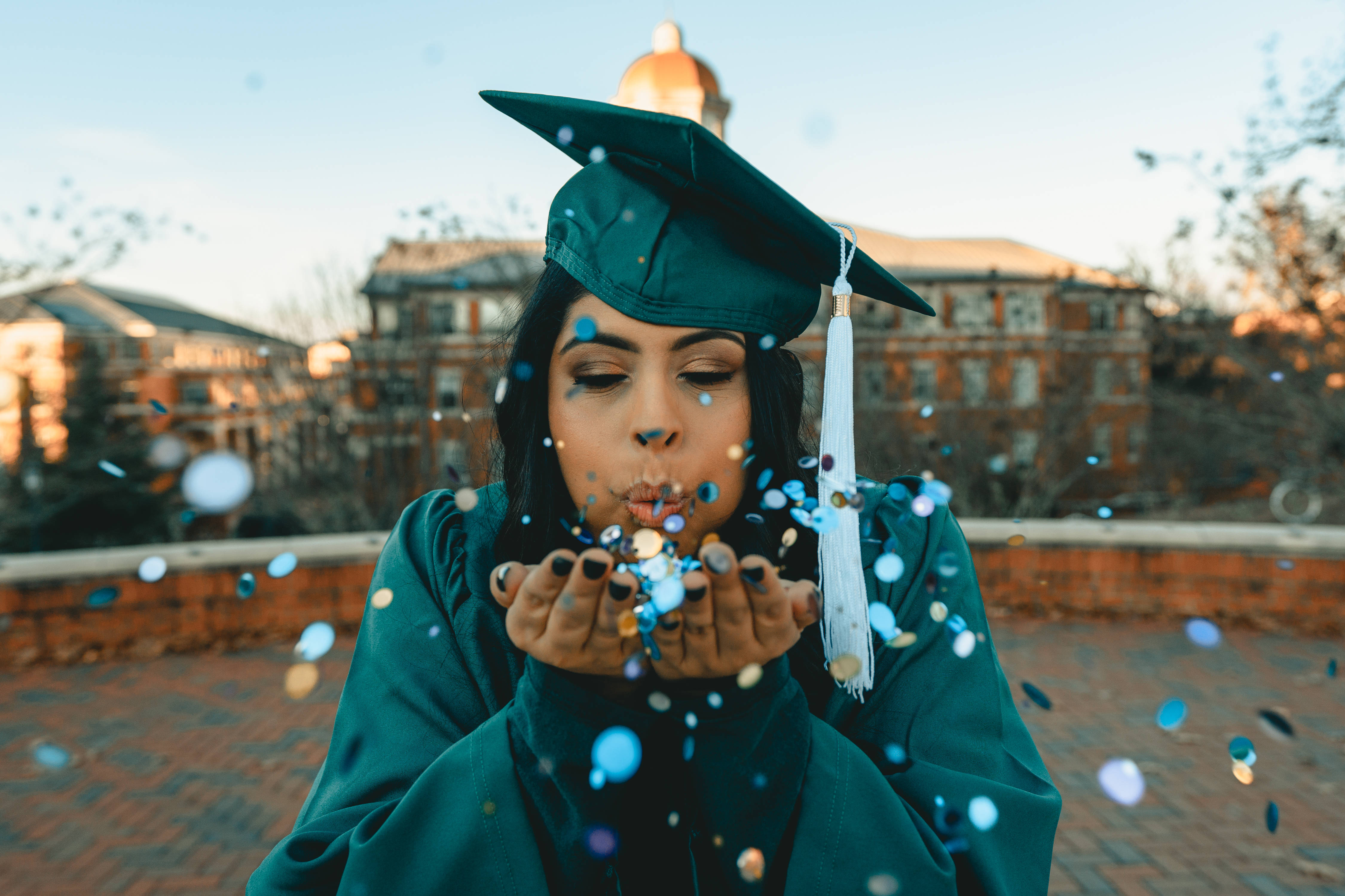 teal cap and gown, golden hour, university campus backdrop, 4K Desktop Wallpaper
