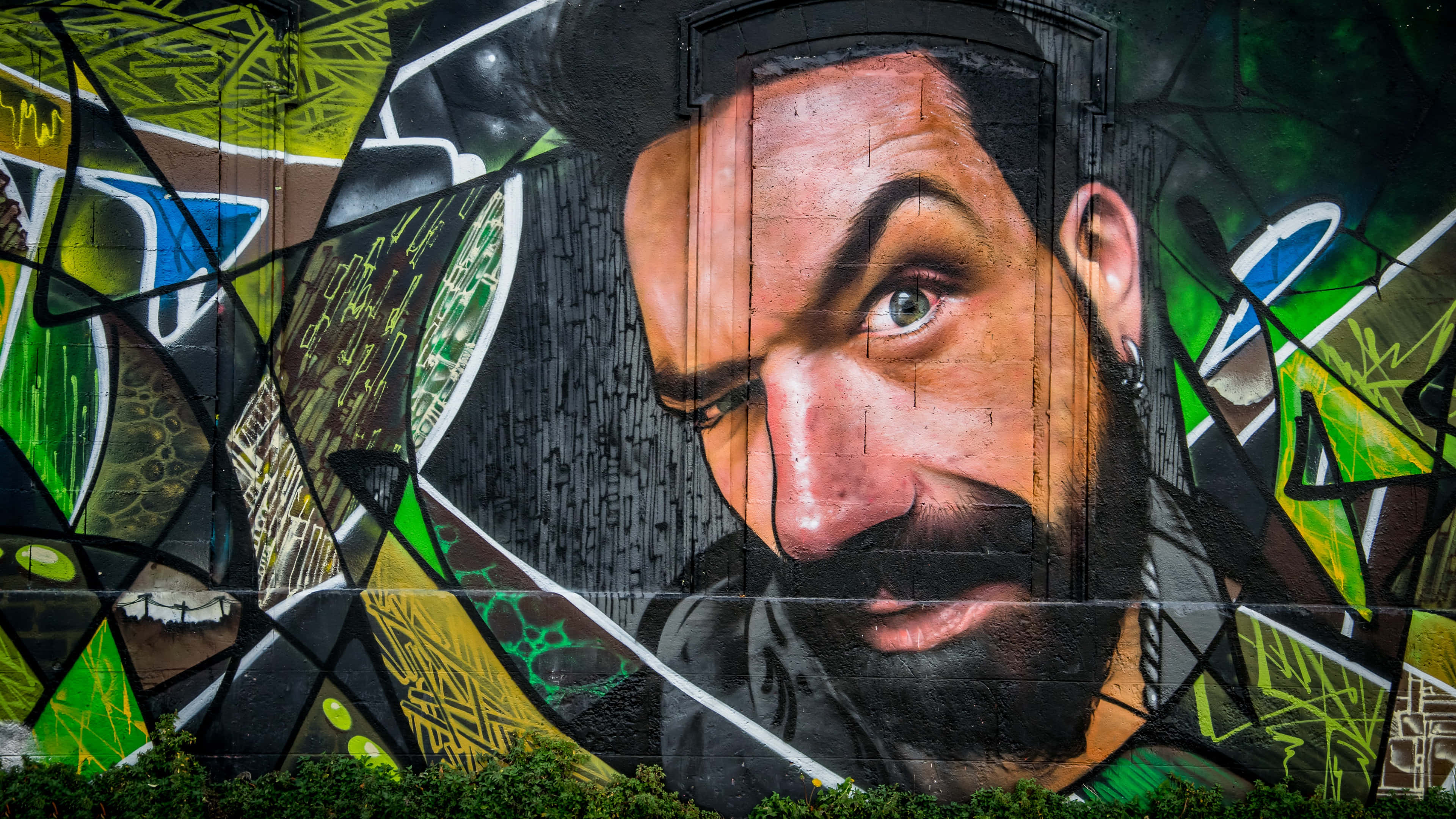 bearded man, vibrant green yellow and black abstract shards, hyperrealistic graffiti mural, 4K Desktop Wallpaper