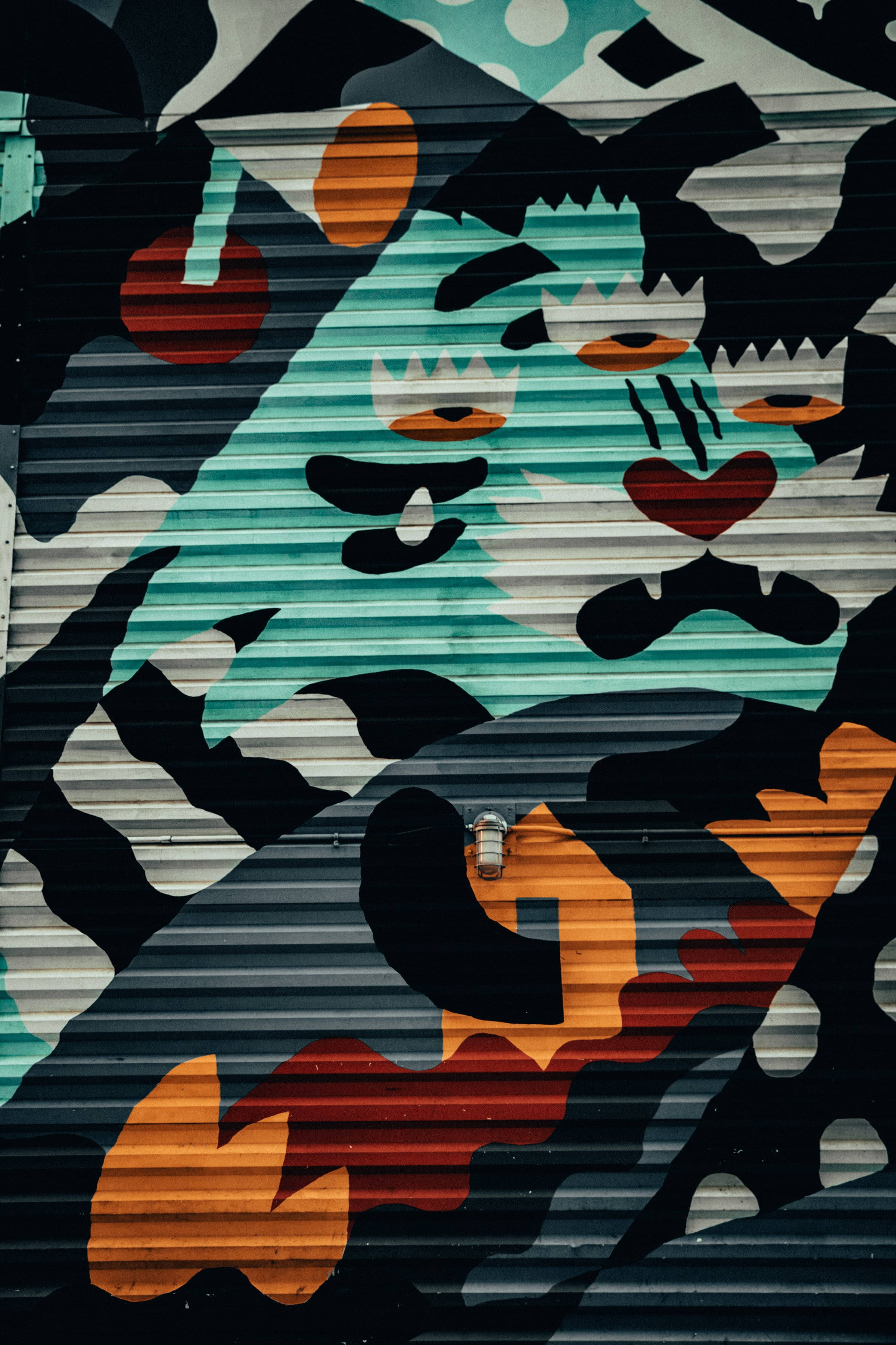 blue abstract animal graffiti, teal orange and black shapes, corrugated metal shutter, 2K Phone Wallpaper